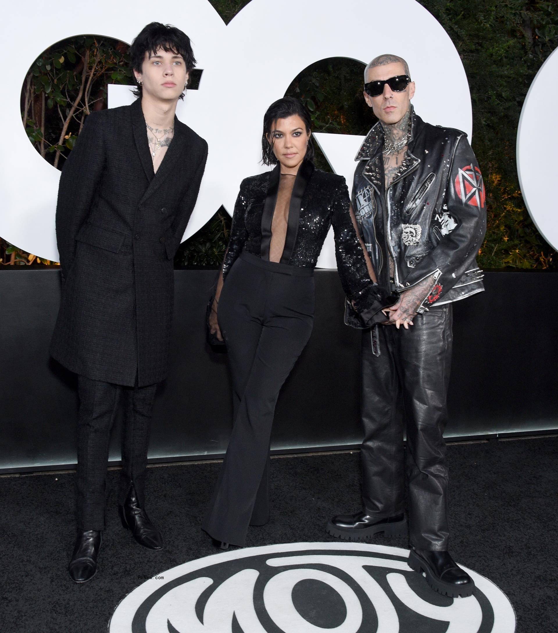 Travis Barker and Kourtney Kardashian pose with Landon on red carpet