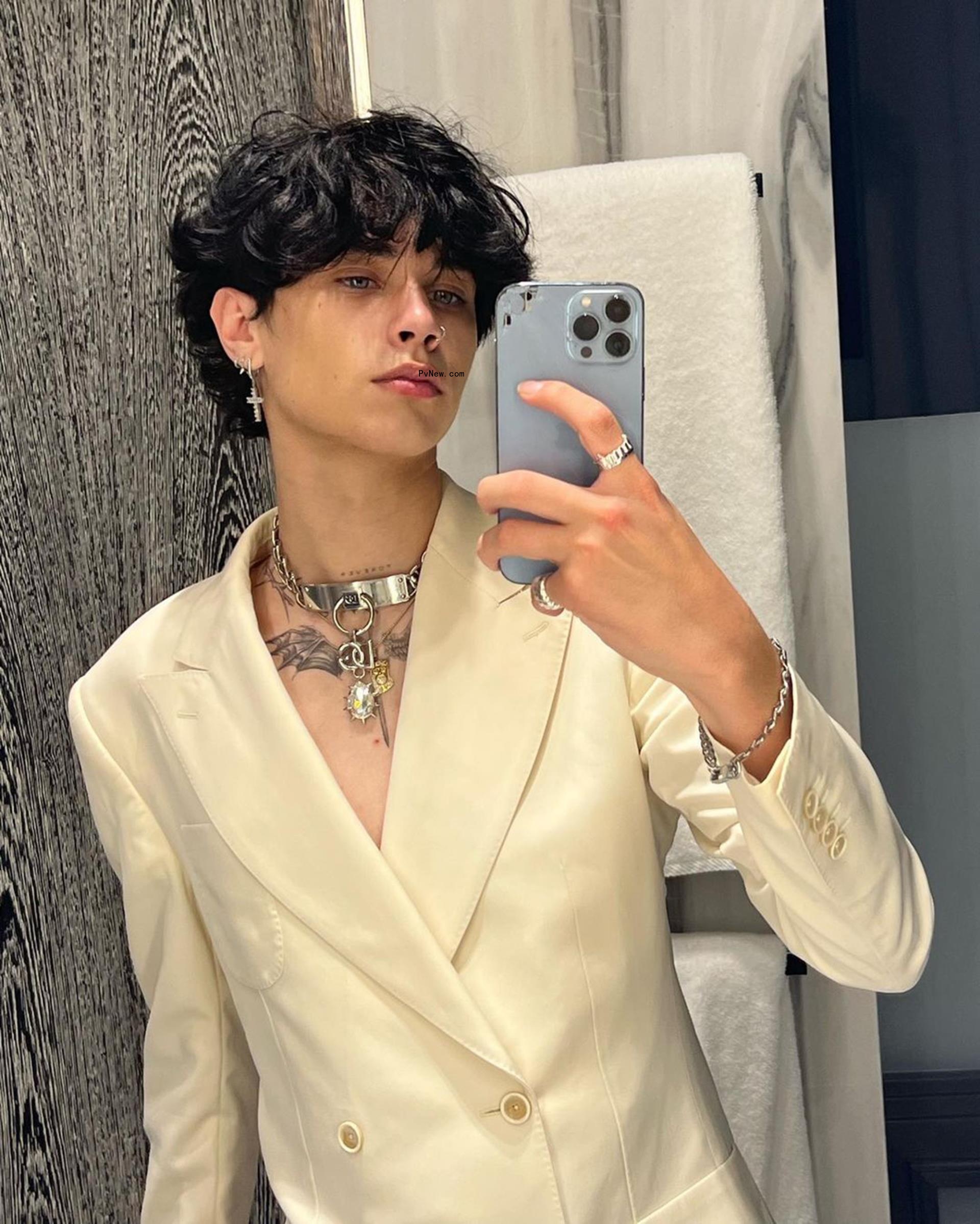 Landon Barker takes mirror selfie in white suit