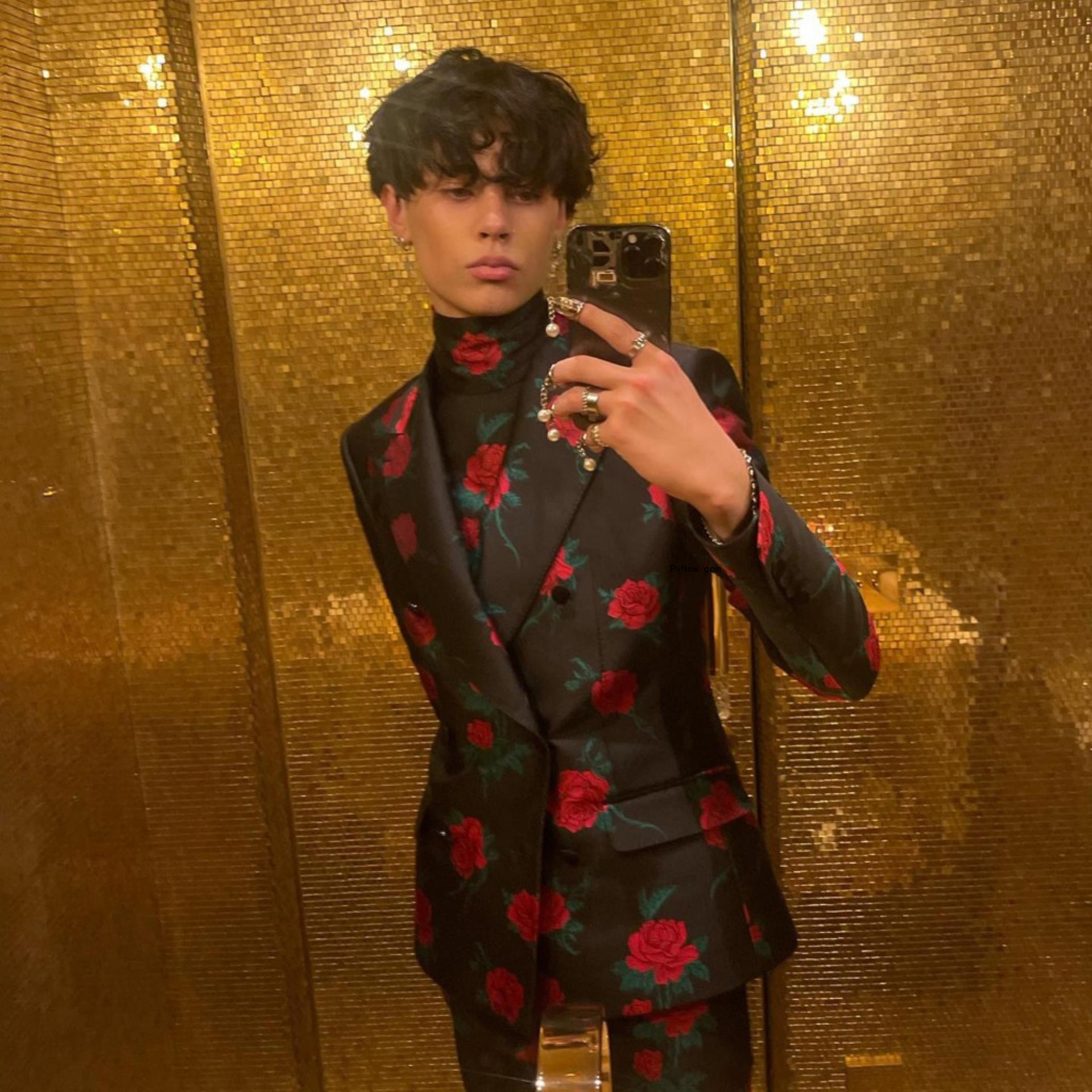Landon Barker takes mirror selfie in floral suit
