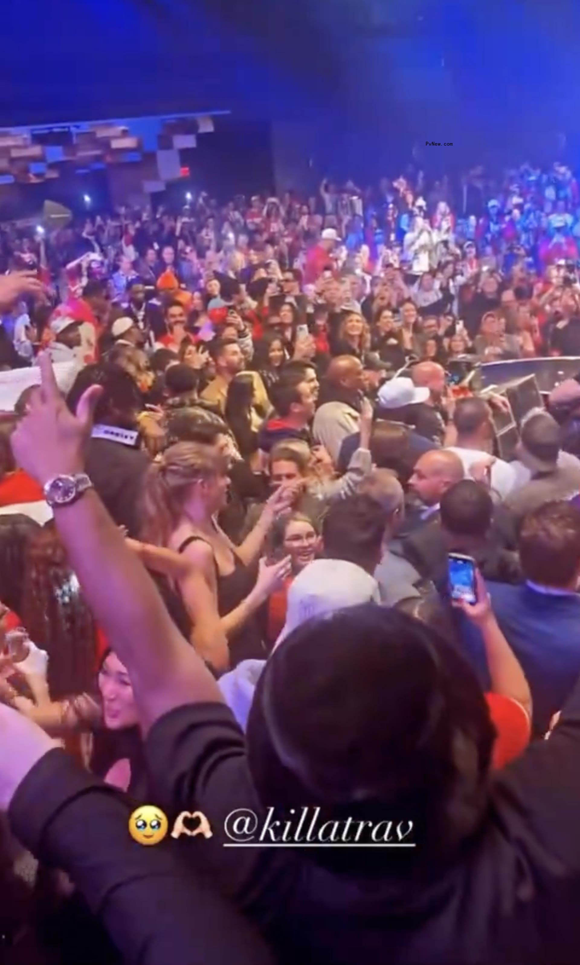 Taylor Swift in the crowd at a party.