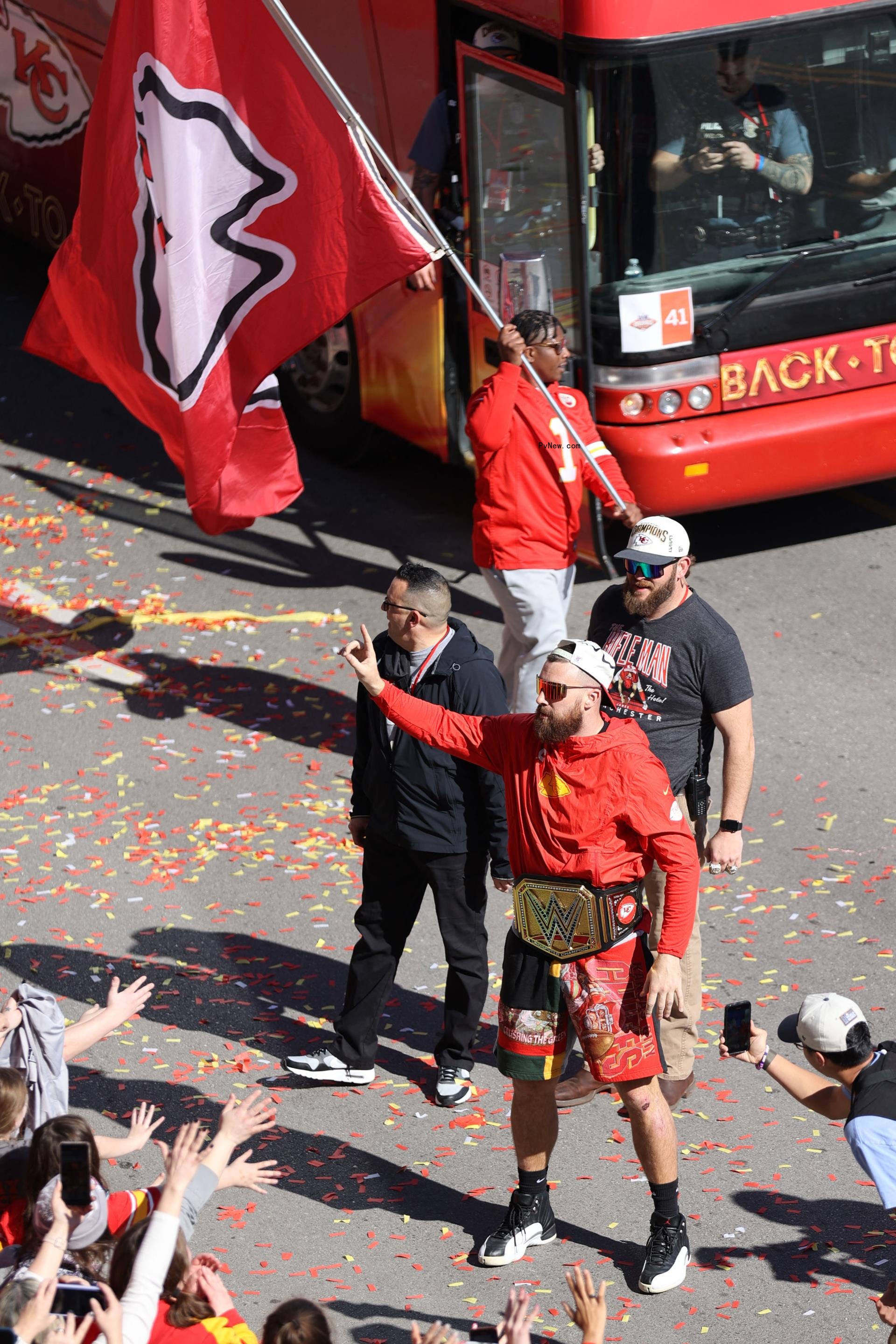 Travis Kelce waving to fans.