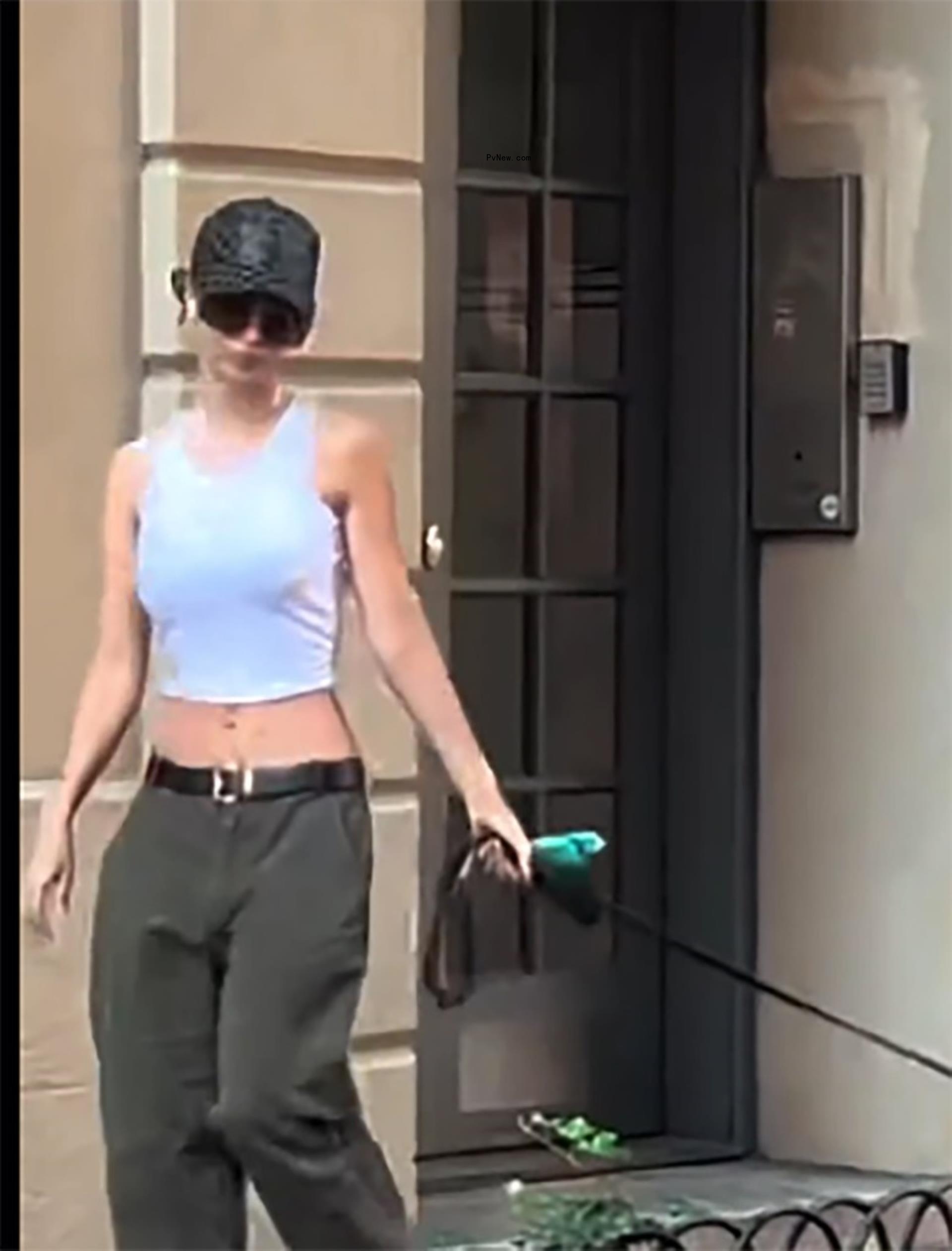 Emily Ratajkowski walking her dog in New York City.