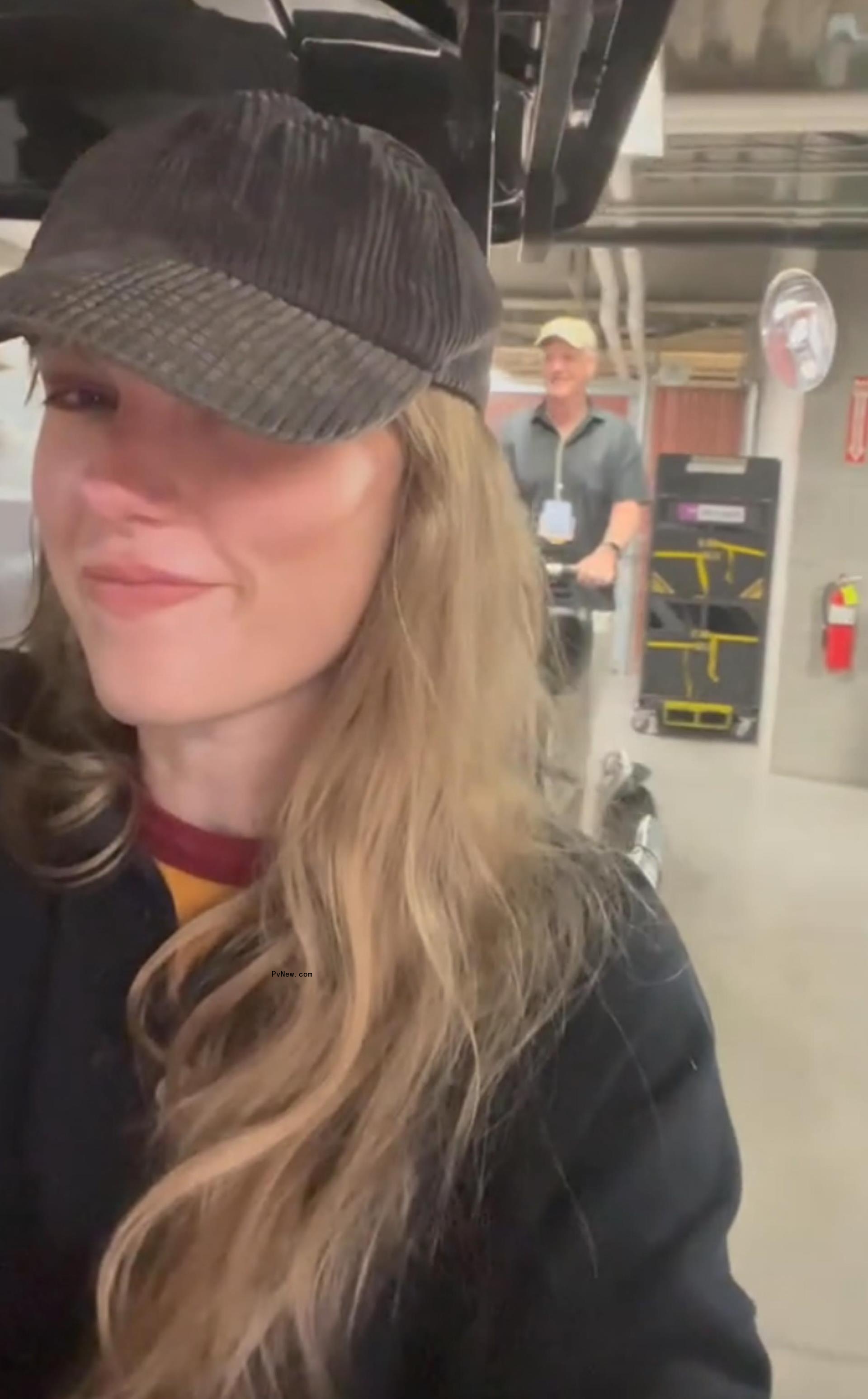 Taylor Swift in a golf cart.