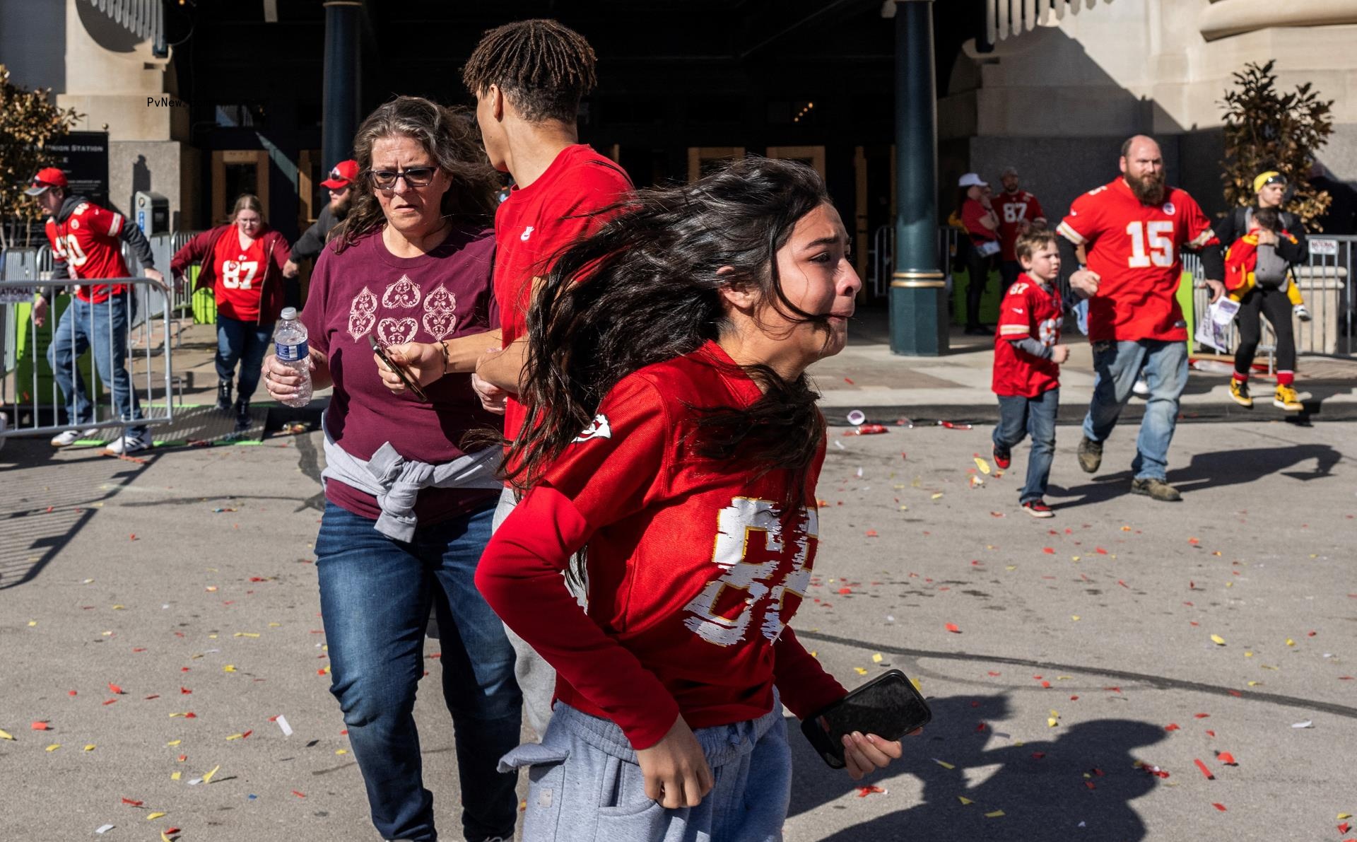 Fans running after a shooting during the Super Bowl parade.