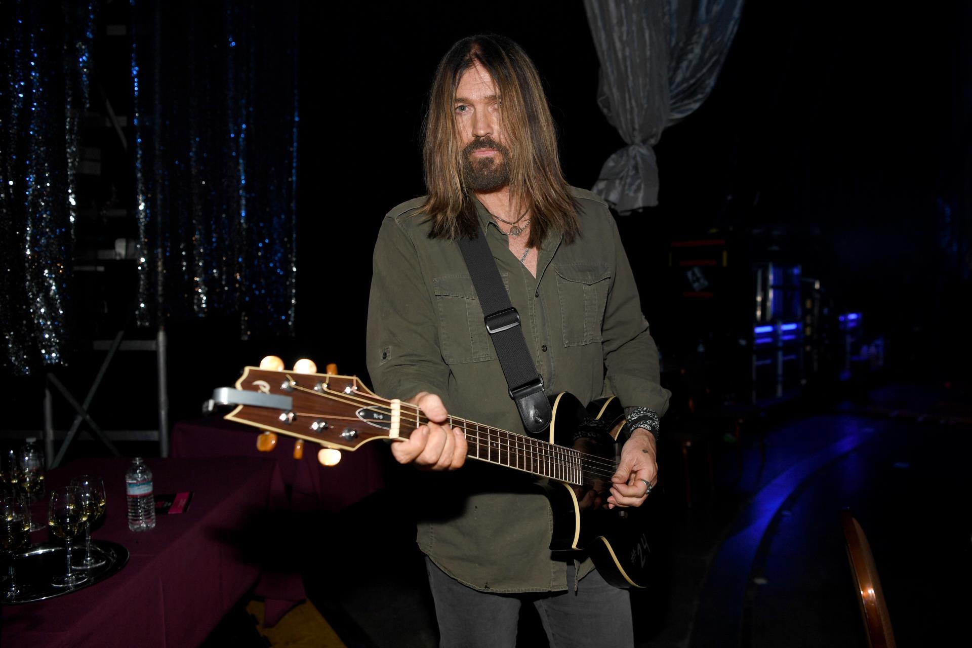 Billy Ray Cryus playing guitar