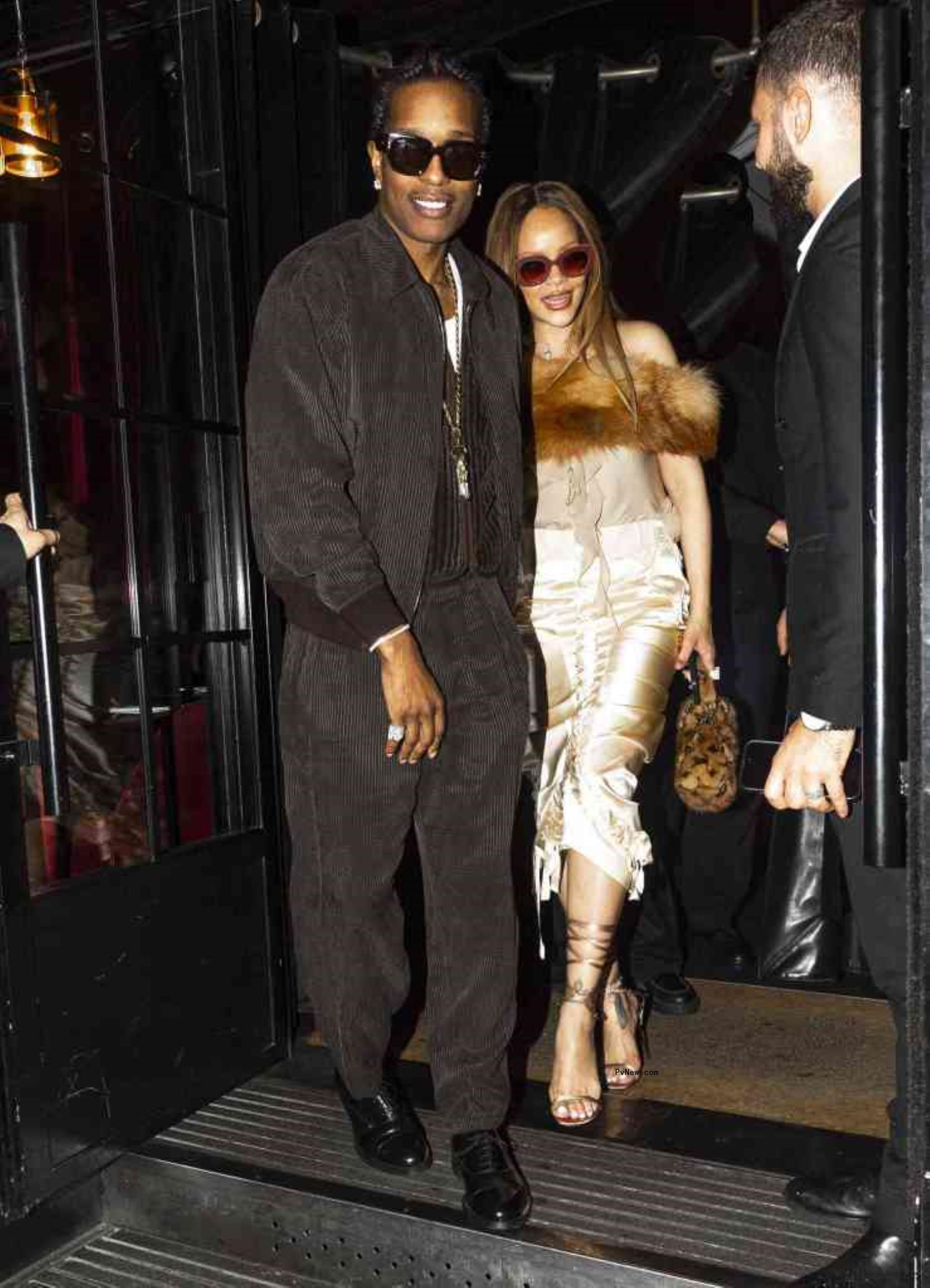 Rihanna and A$AP Rocky leaving hotel.