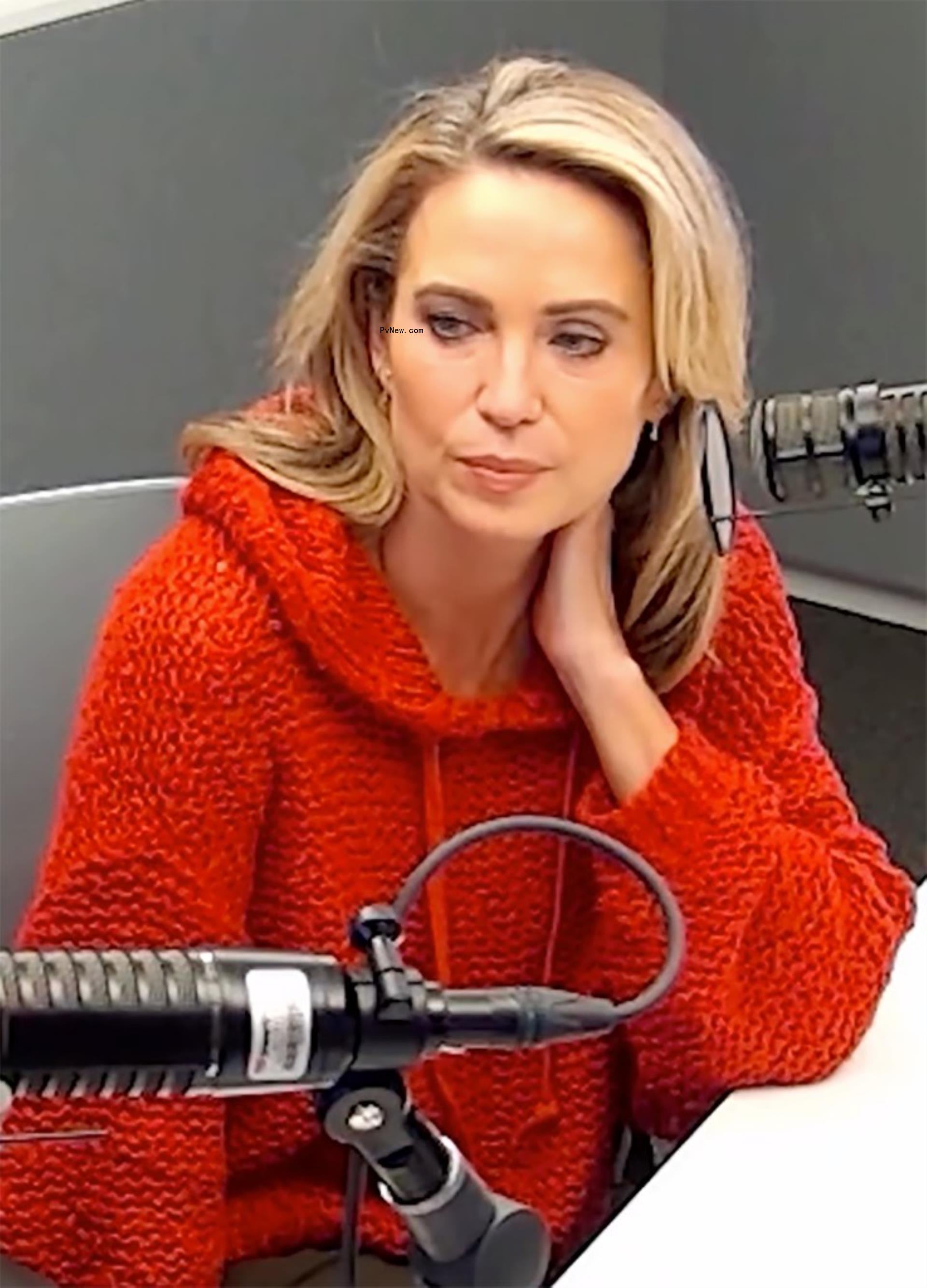 amy robach sitting with her hand on her neck