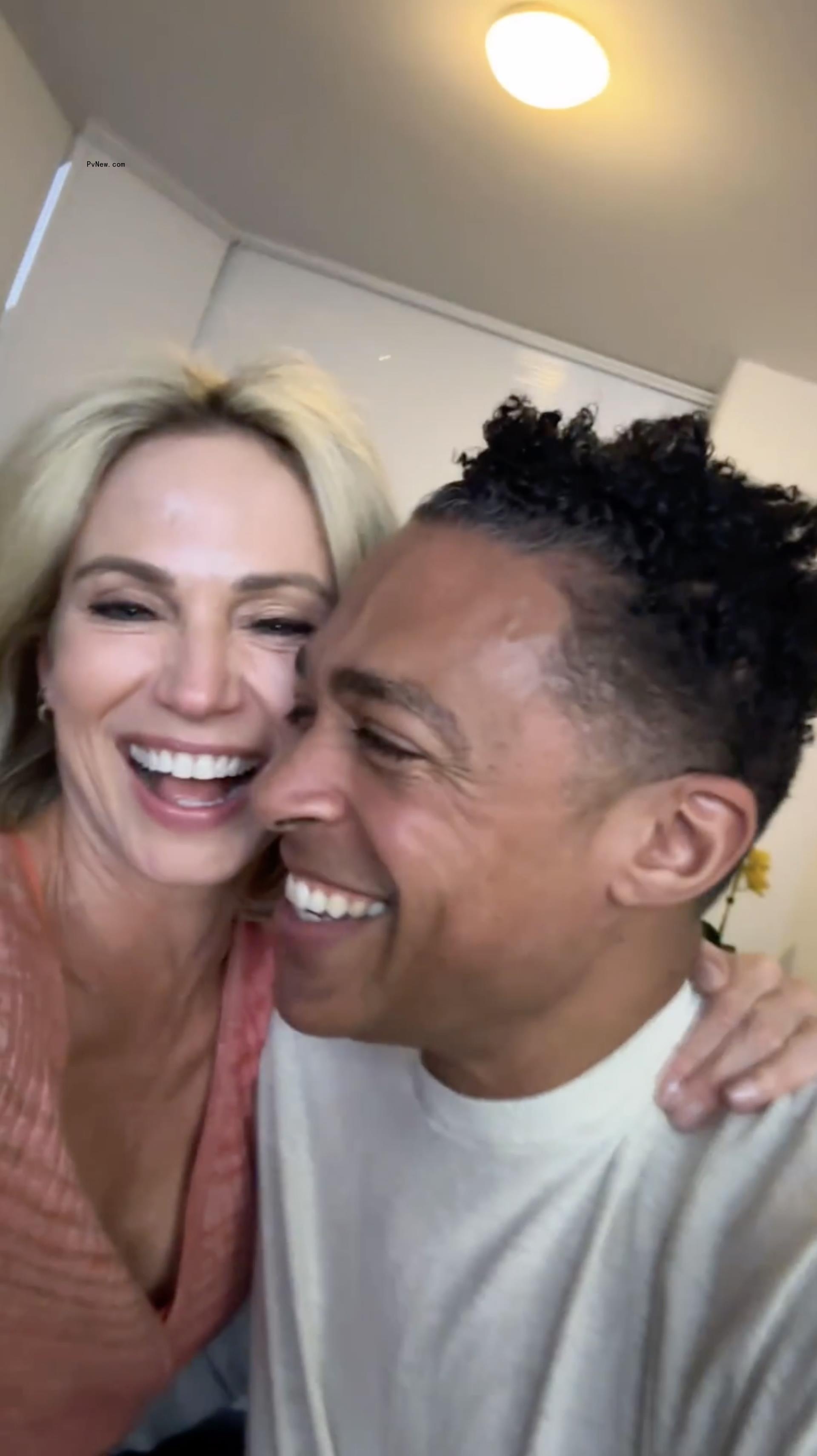 selfie of tj holmes and amy robach laughing