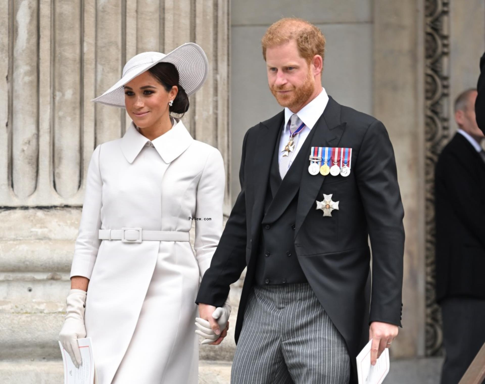 Meghan Markle and Prince Harry walking together.