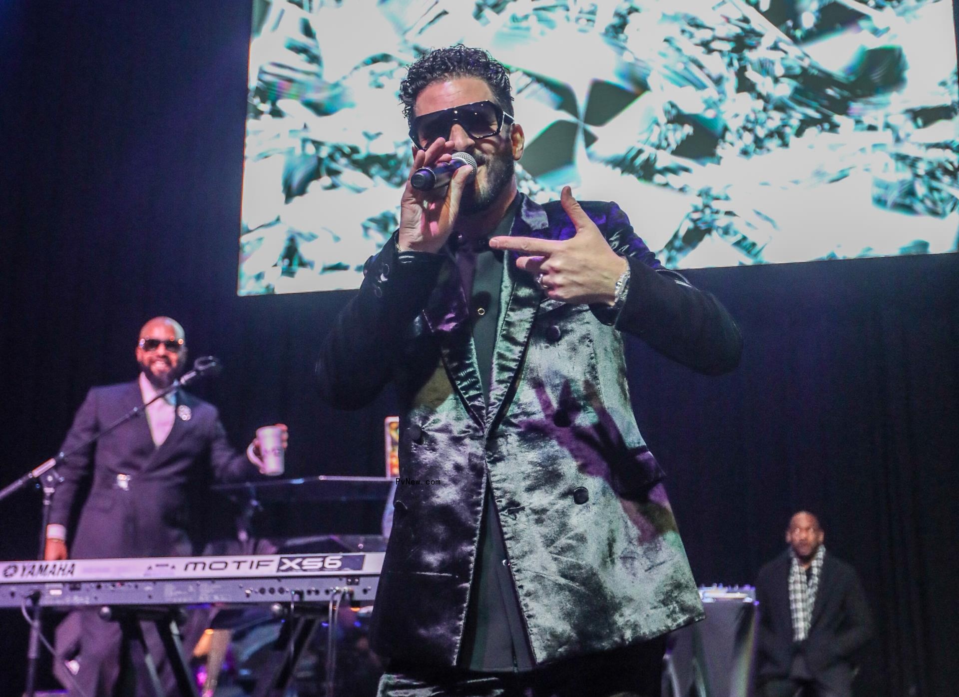 Jon B performing on stage.