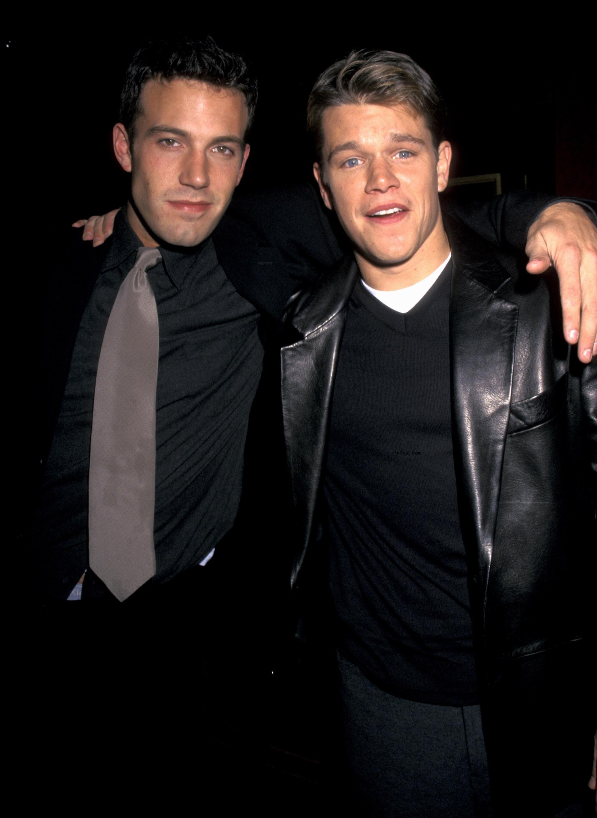 Ben Affleck posing with Matt Damon at an event.