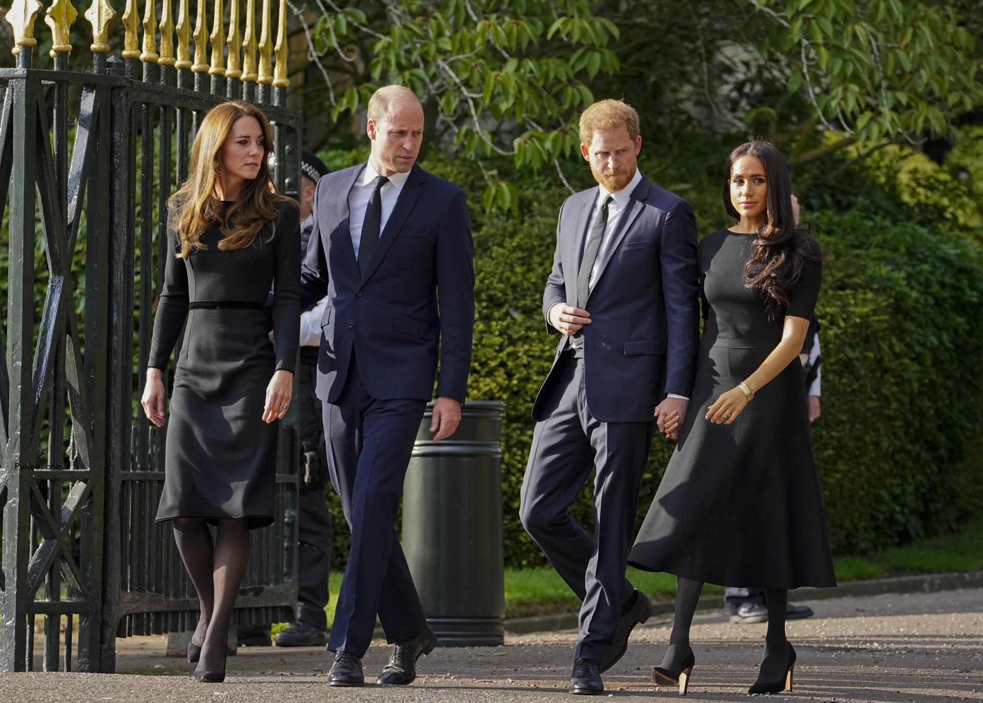 Prince William, Kate Middleton, Prince Harry and Meghan Markle walking together.