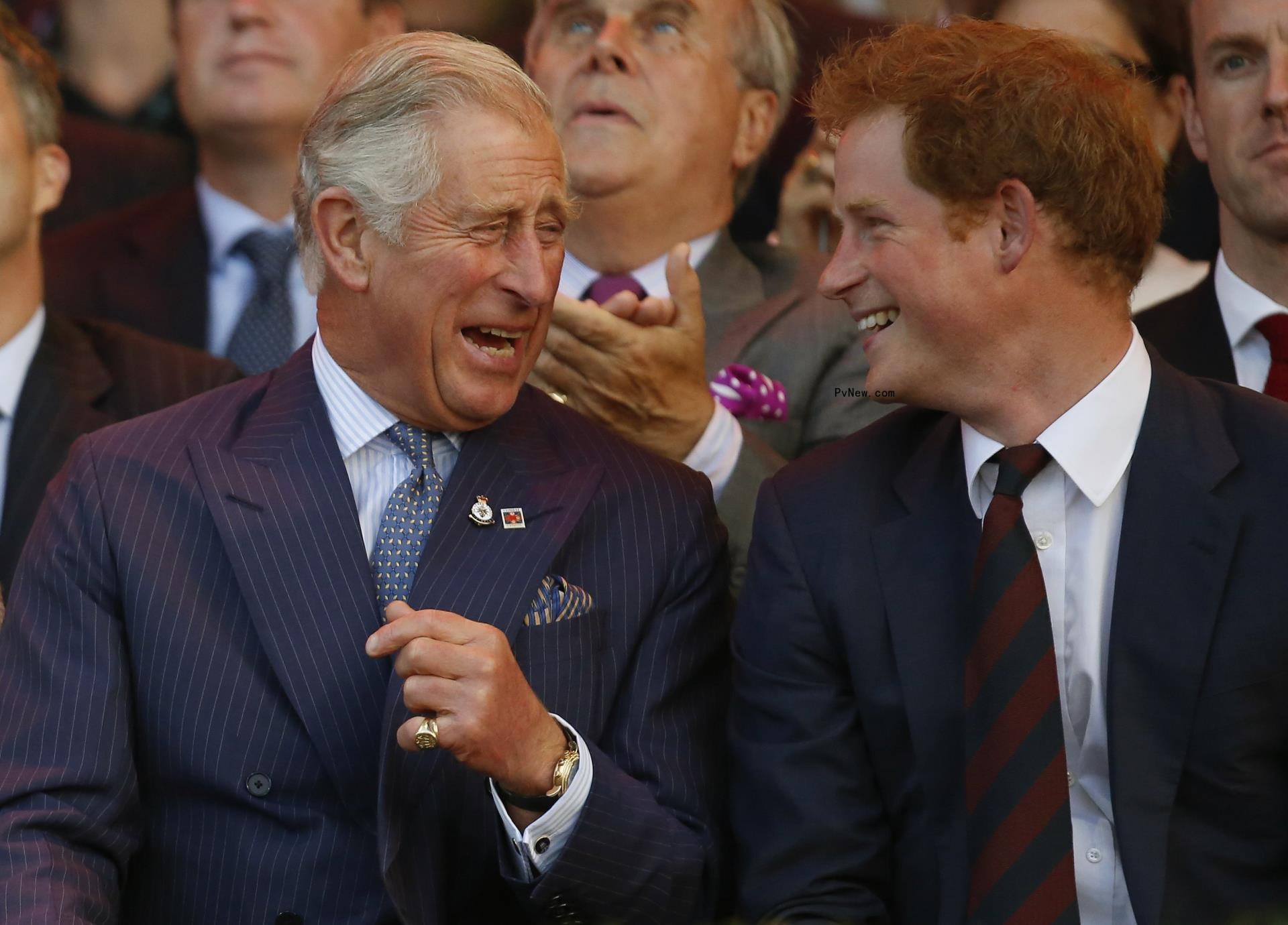 Prince Harry talking to King Charles III.