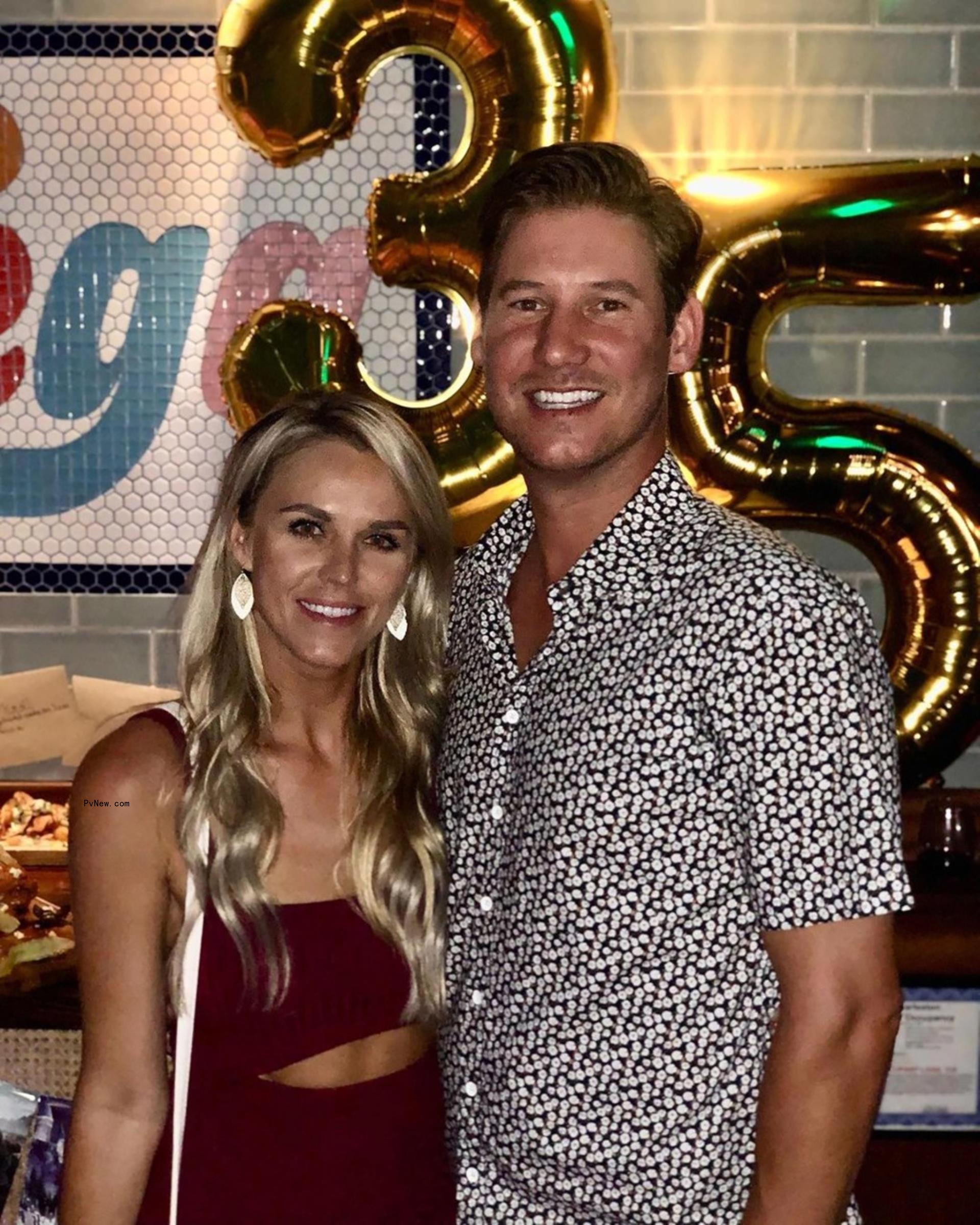 Olivia Flowers and Austen Kroll pose at party