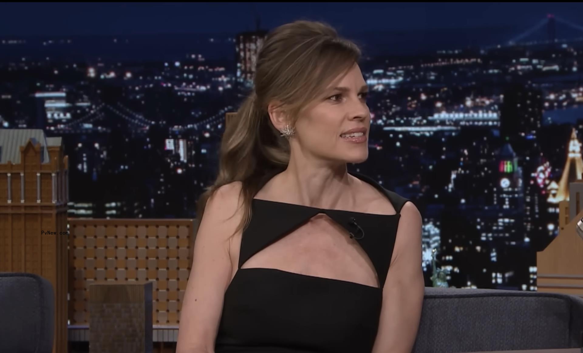 Hilary Swank talking on