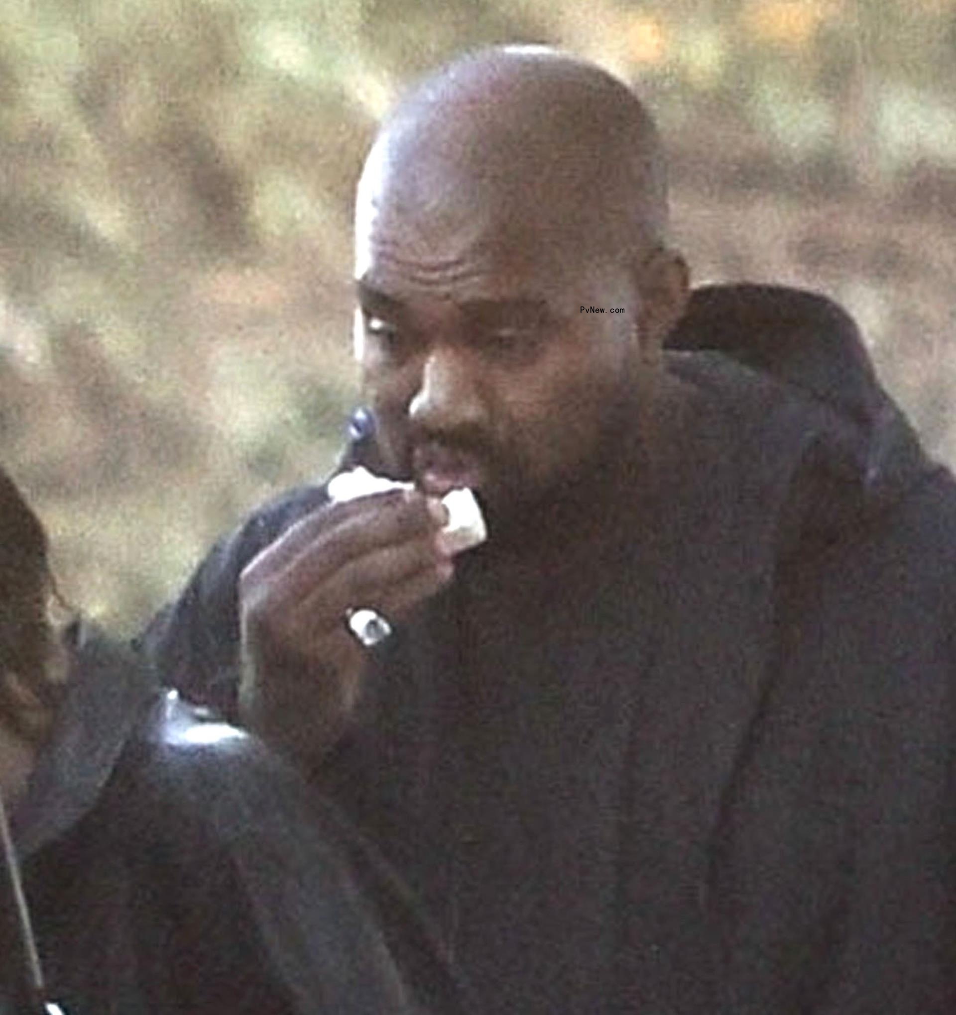 Kanye West eating.
