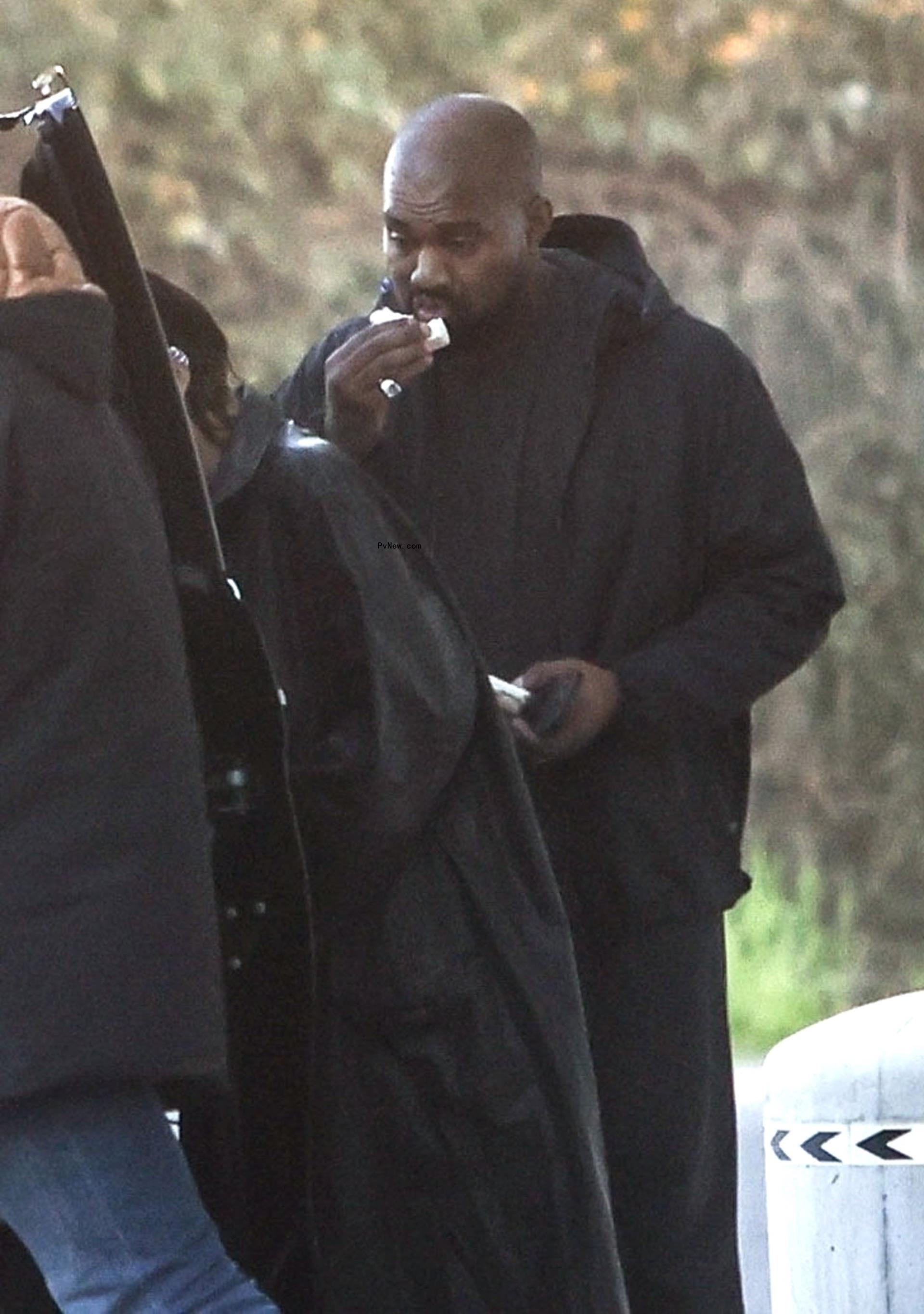 Kanye West eating a snack