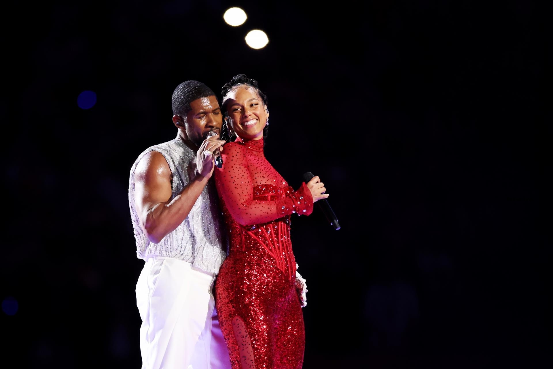 Alicia Keys and Usher on stage at the Super bowl.