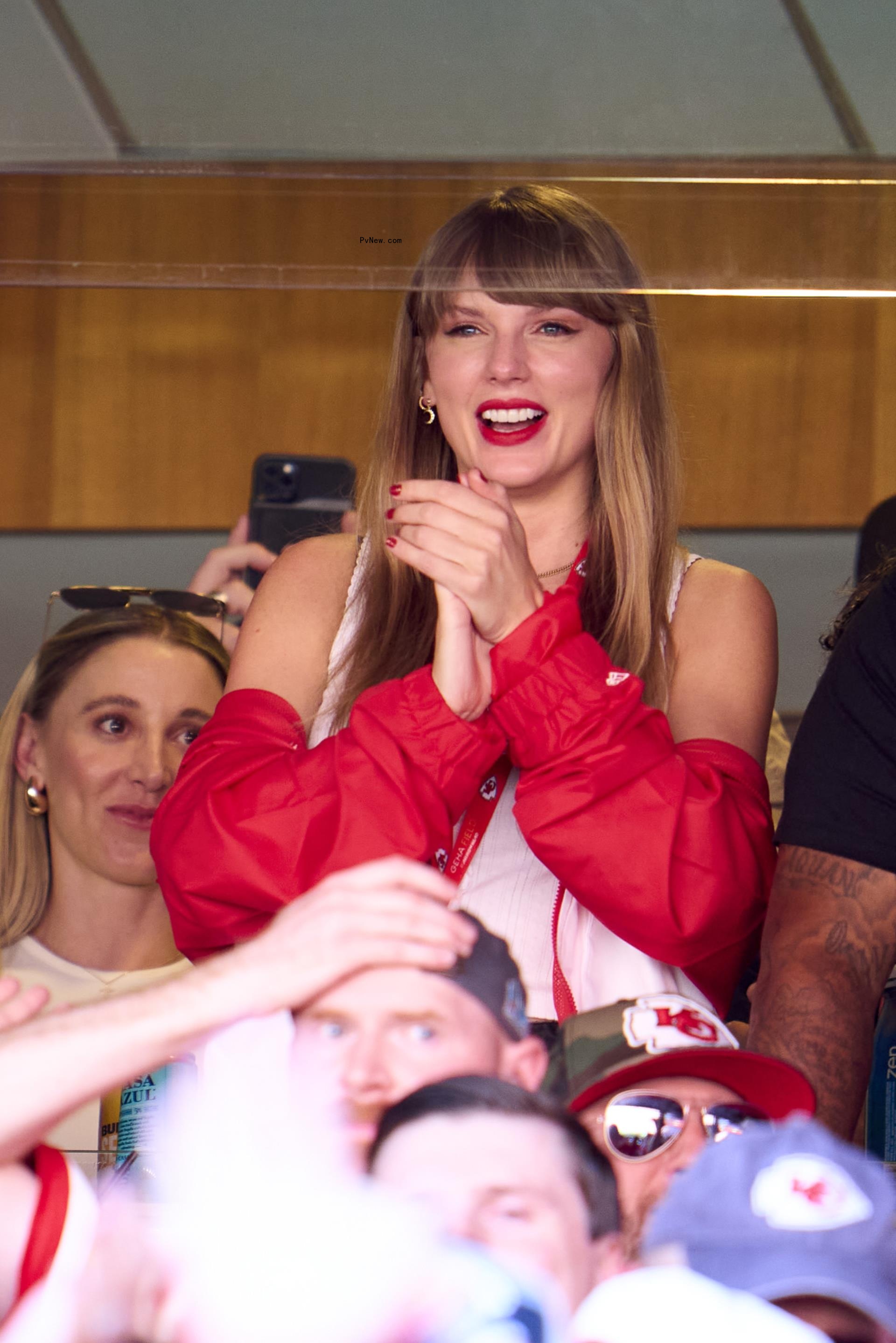 Taylor Swift cheering at an NFL game.