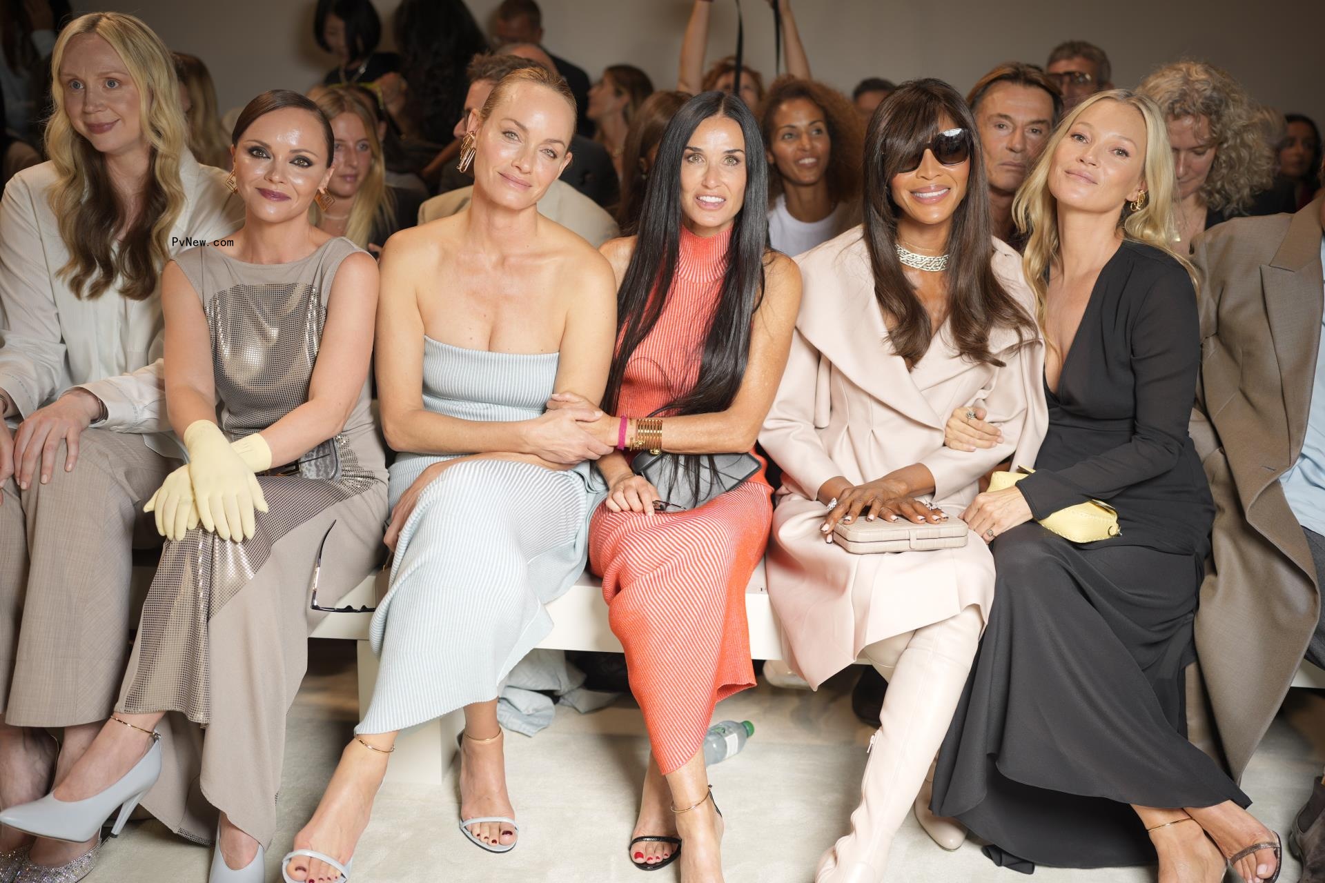 Gwendoline Christie, Christina Ricci, Amber Valletta, Demi Moore, Naomi Campbell, Kate Moss sitting at a fashion show