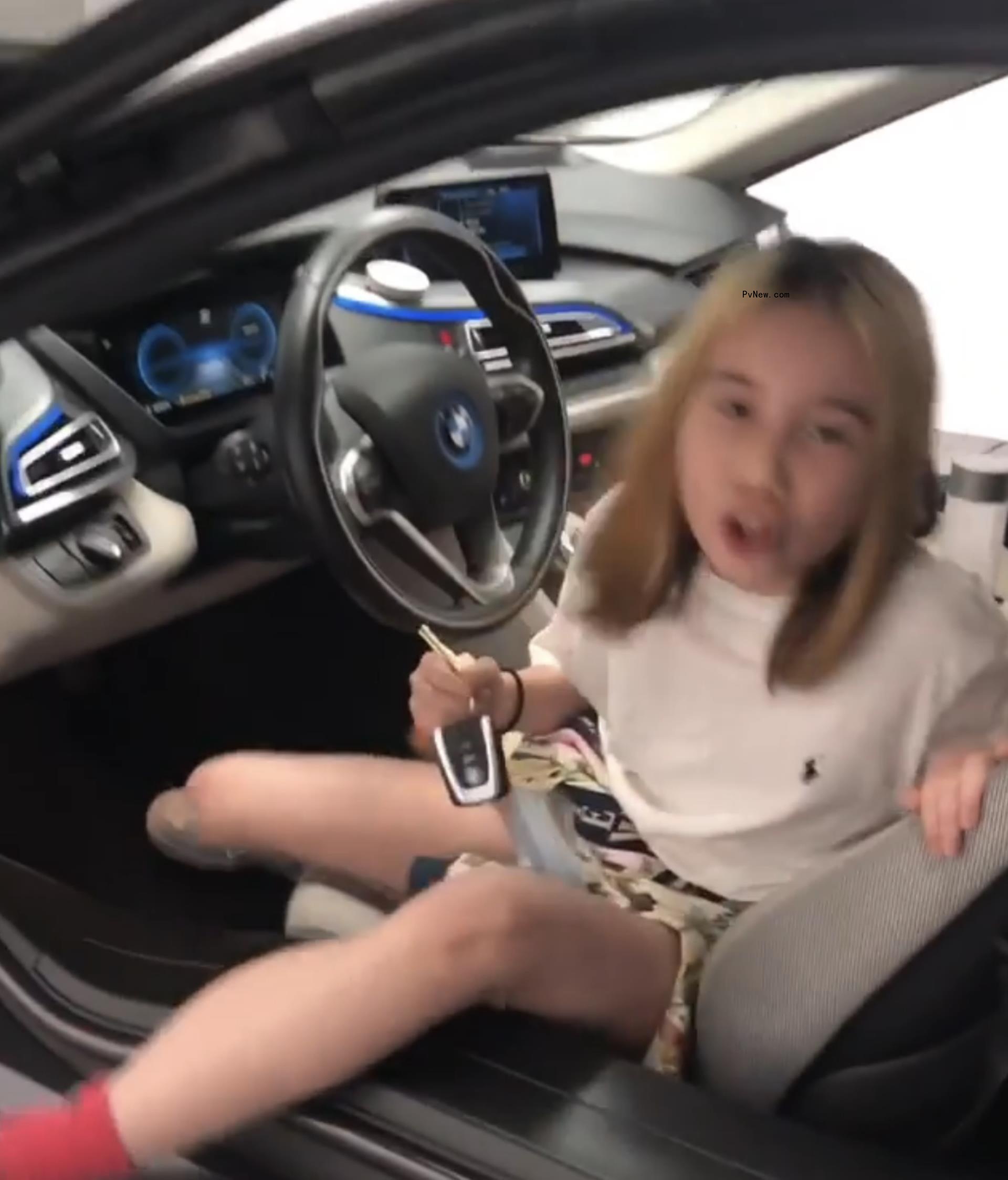 Lil Tay inside of a car.