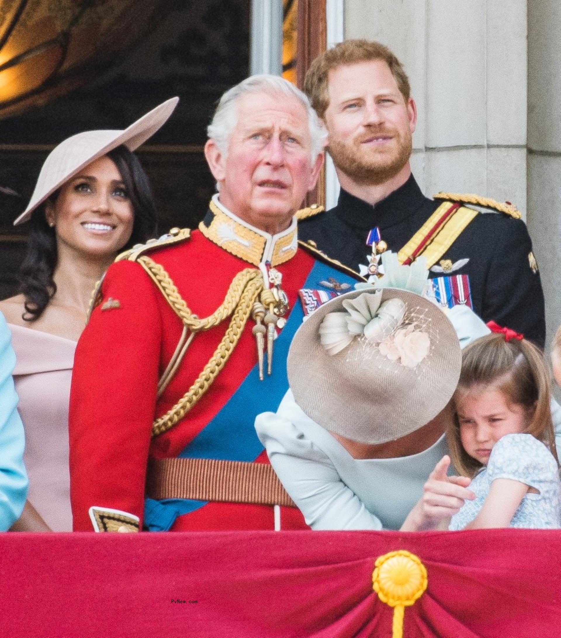 Prince Harry and King Charles III with Meghan Markle.