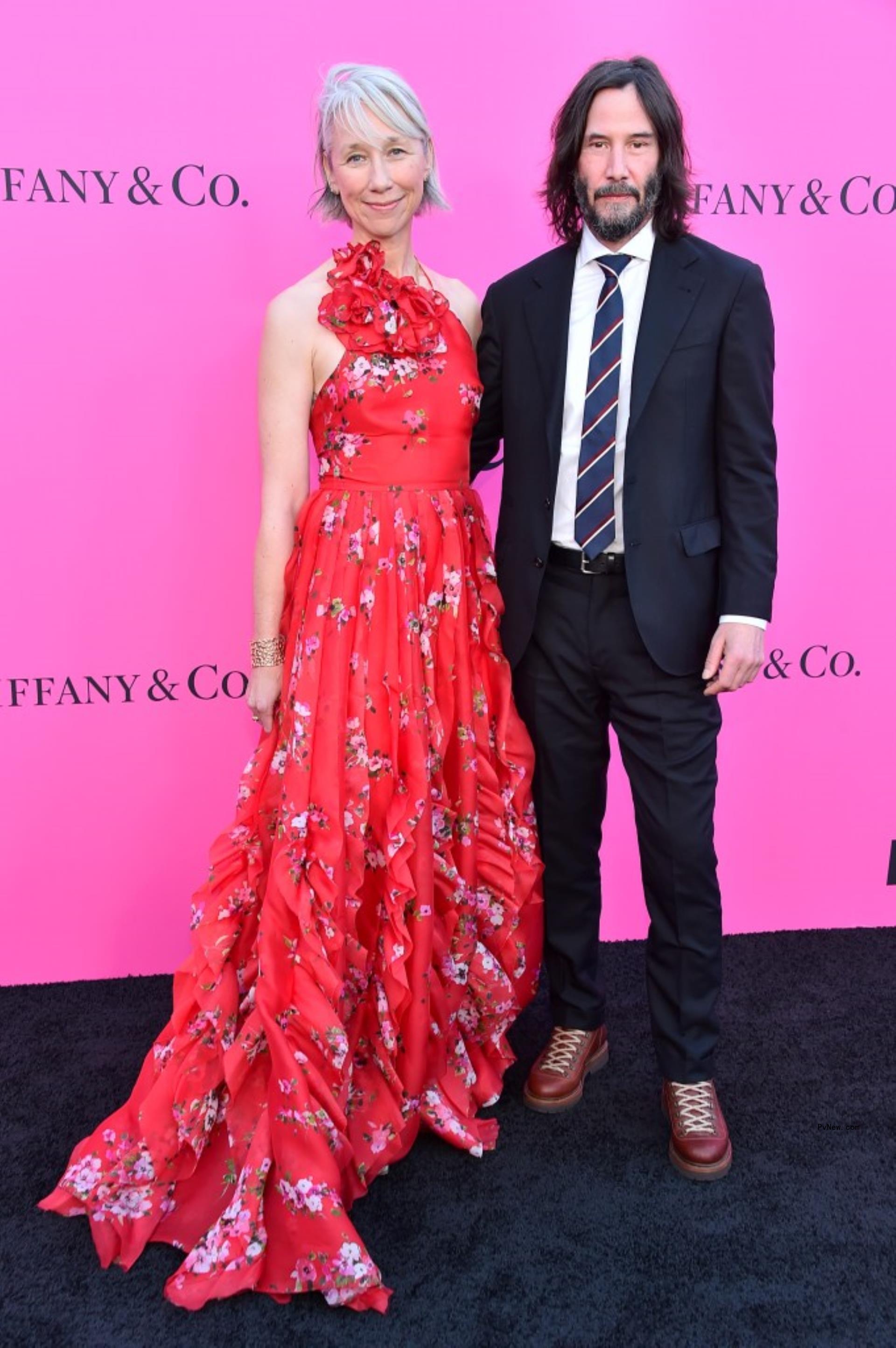 Alexandra Grant and Keanu Reeves on the red carpet.