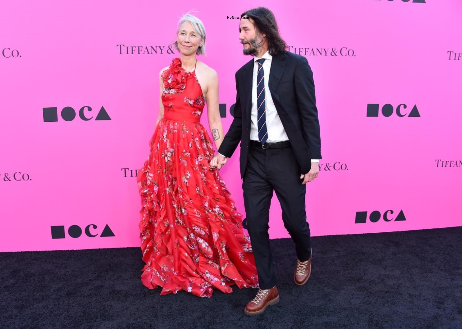 Keanu Reeves and Alexandra Grant on the red carpet.
