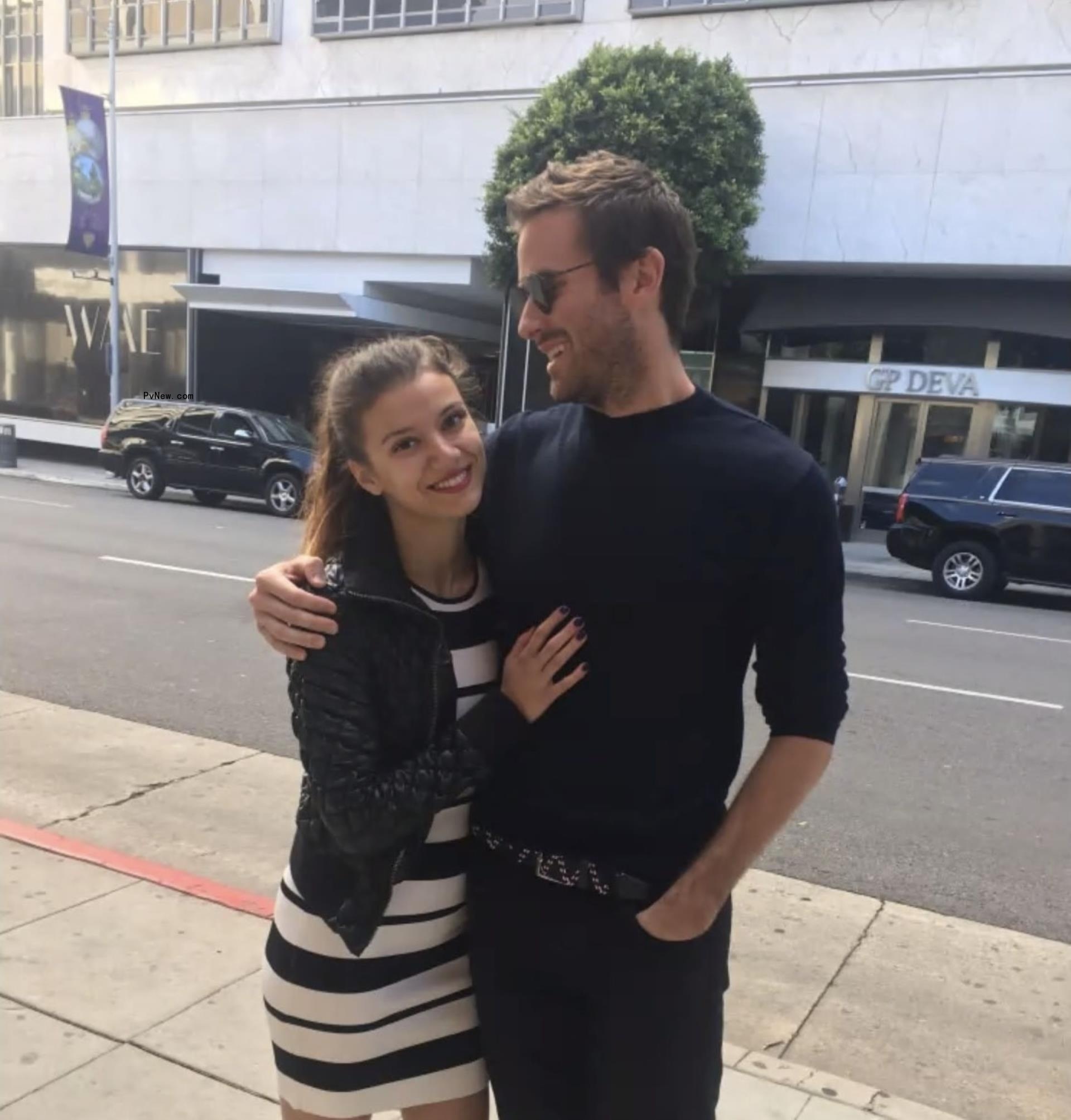 armie hammer with his arms around ex Effie