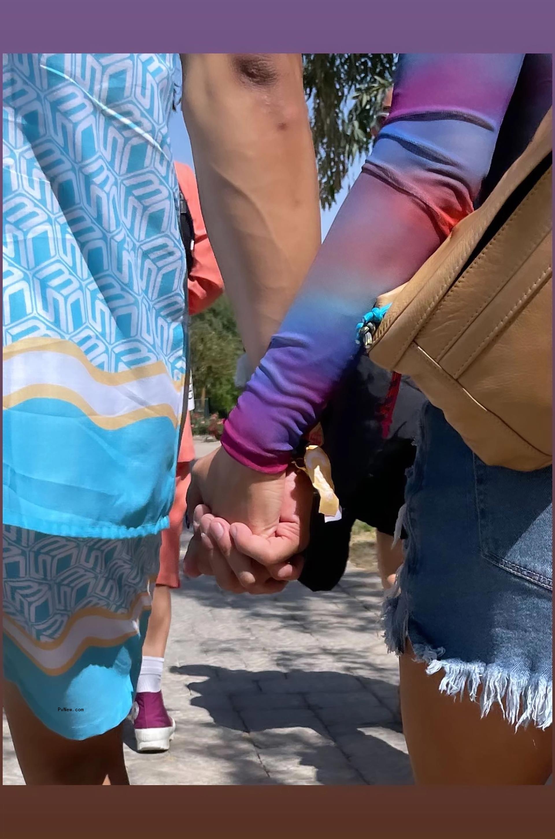 Ariana Madix and Daniel Wai hold hands