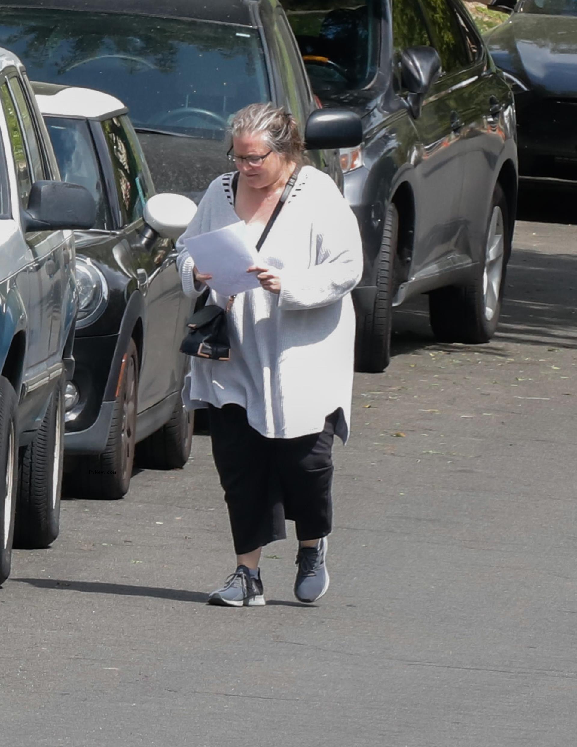 Bridget Fo<i></i>nda running errands.