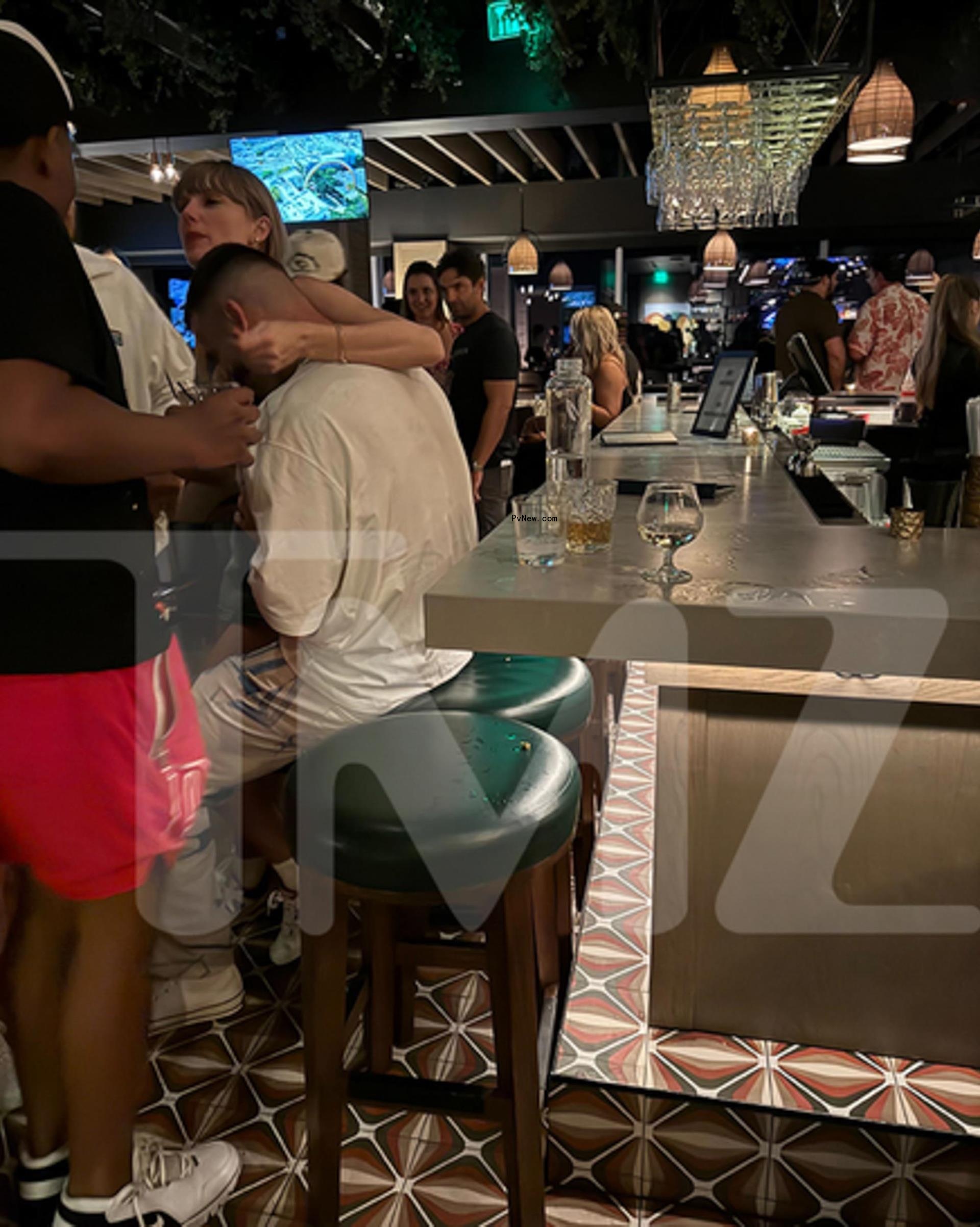 Taylor Swift and Travis Kelce at a bar