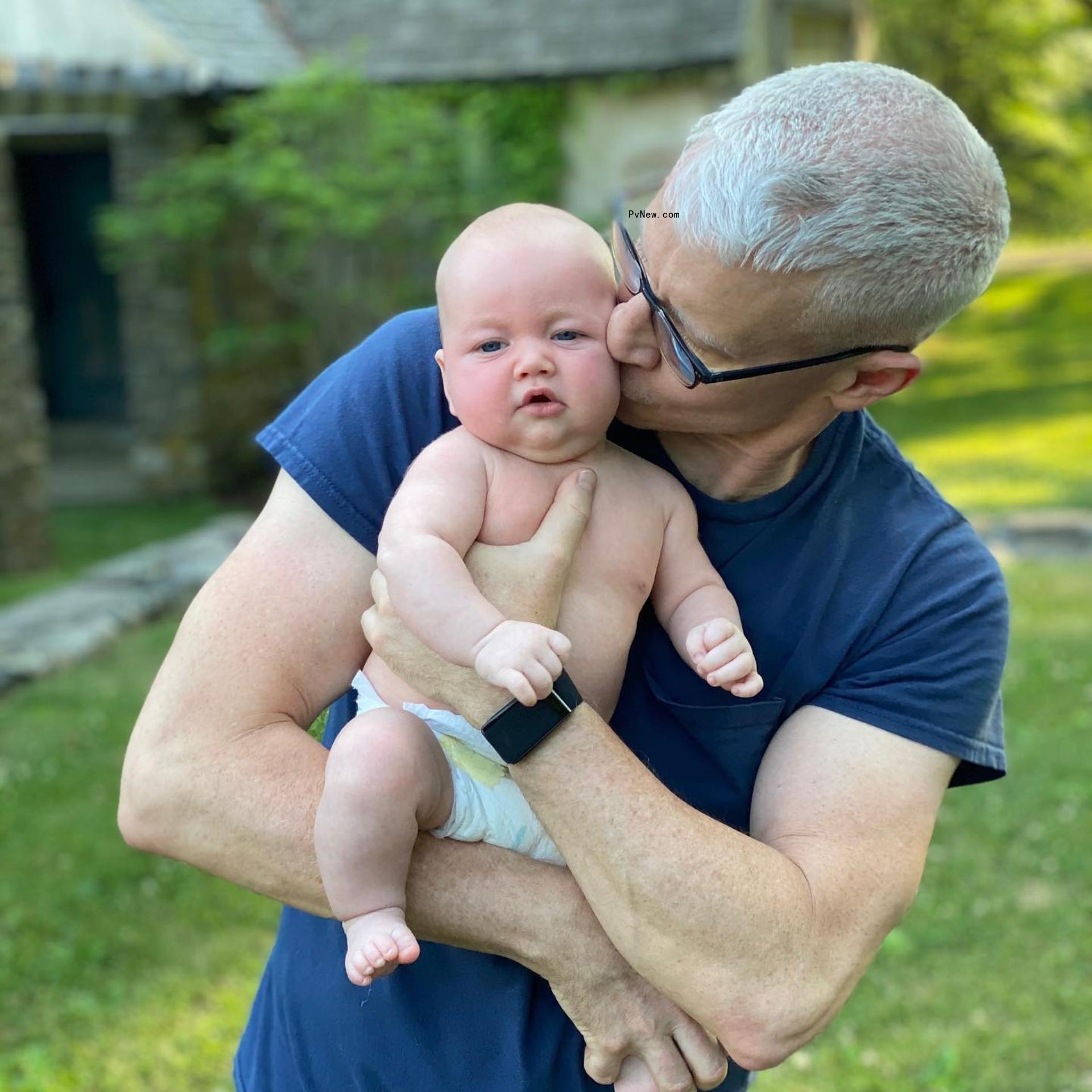 Anderson Cooper kissing his baby.
