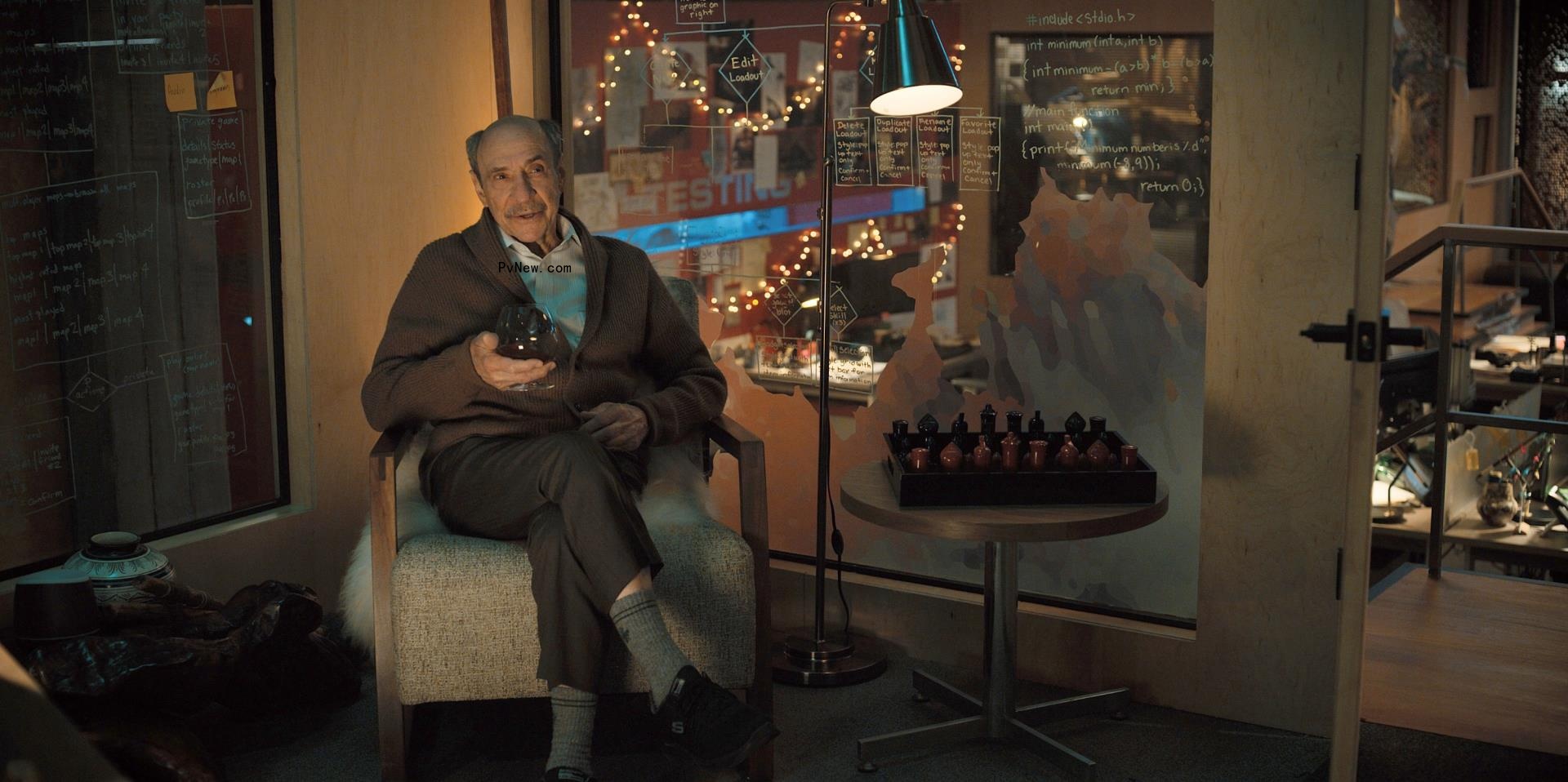 F. Murray Abraham sitting in a chair in