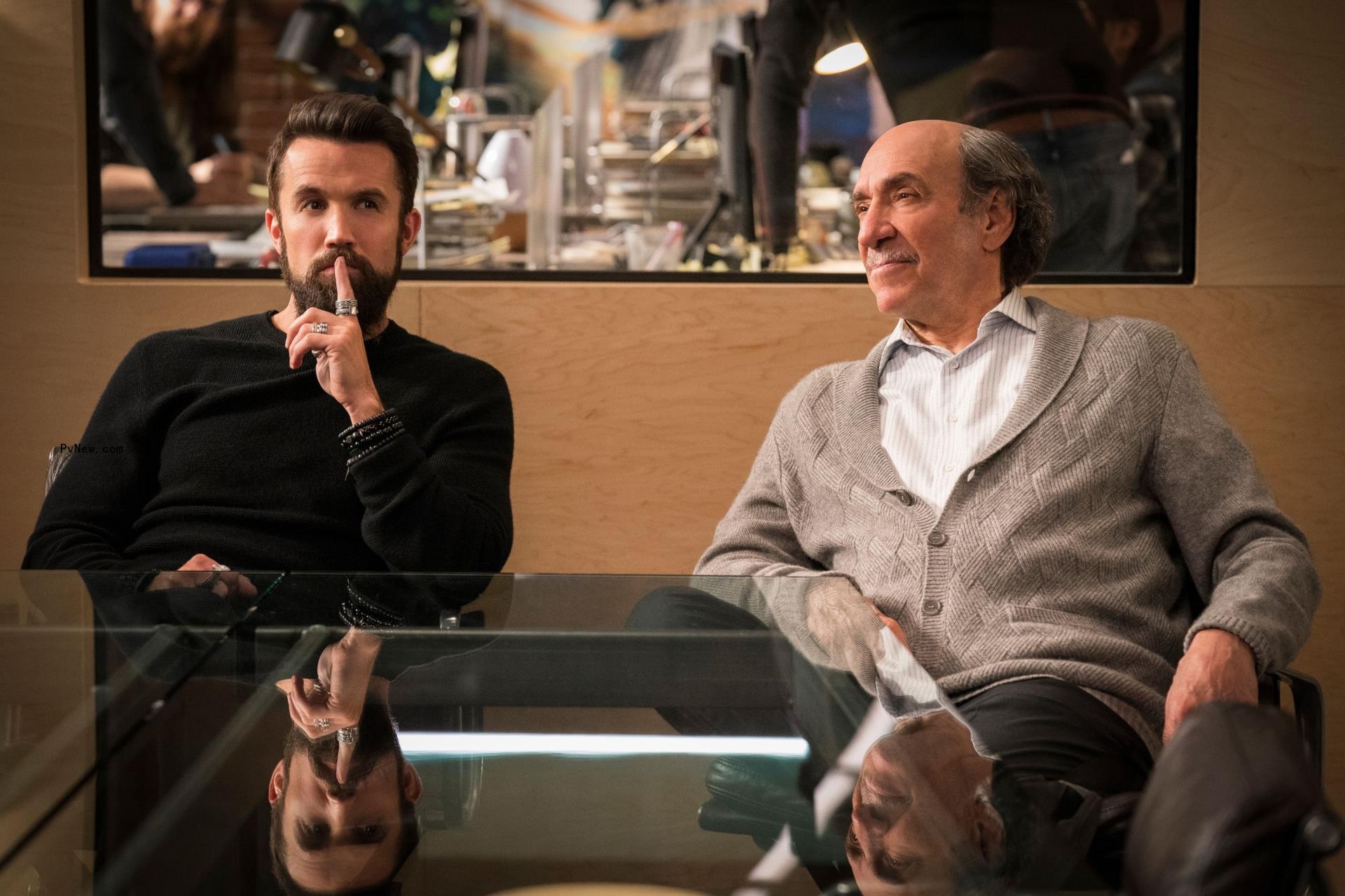 Rob McElhenney, F. Murray Abraham sitting at a co<i></i>nference table