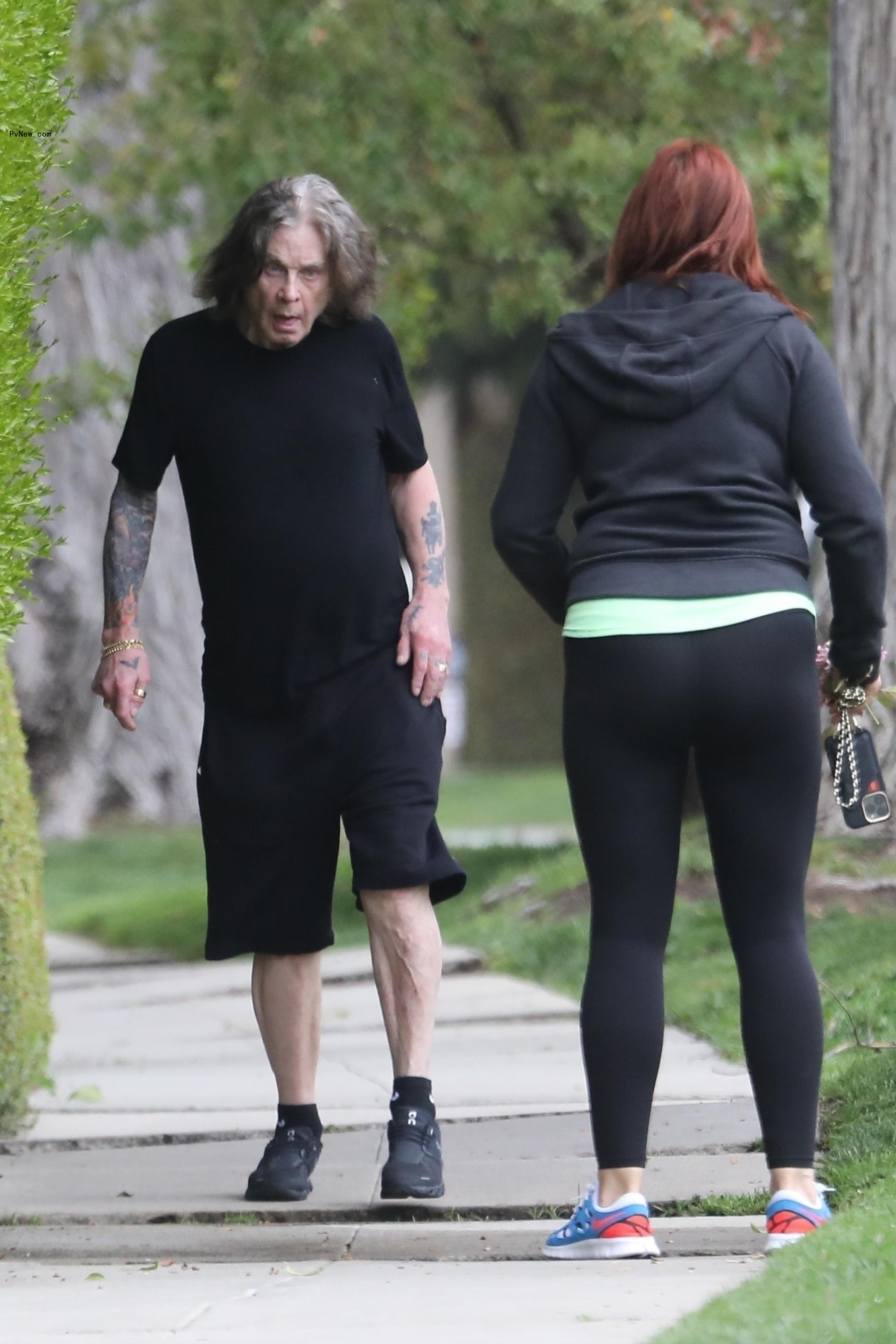 Ozzy Osbourne walks without cane in black outfit