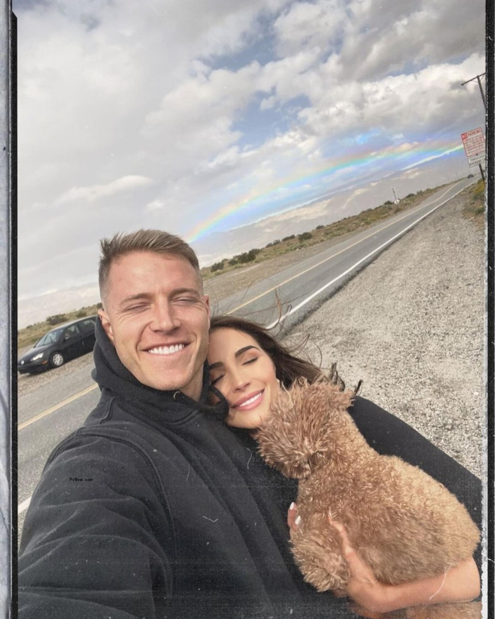 Olivia Culpo and Christian McCaffrey with dog
