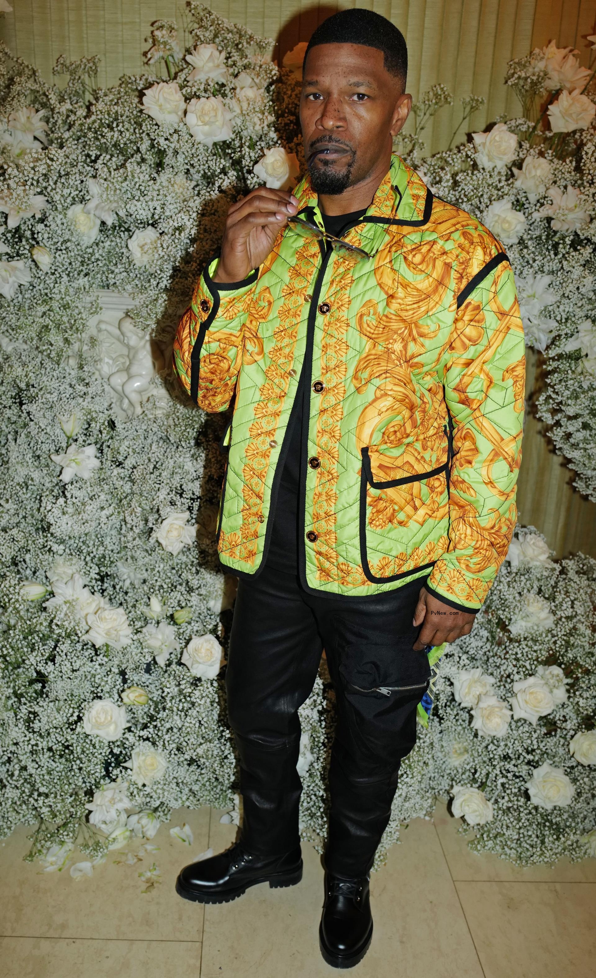 Jamie Foxx wears colorful jacket and black jeans