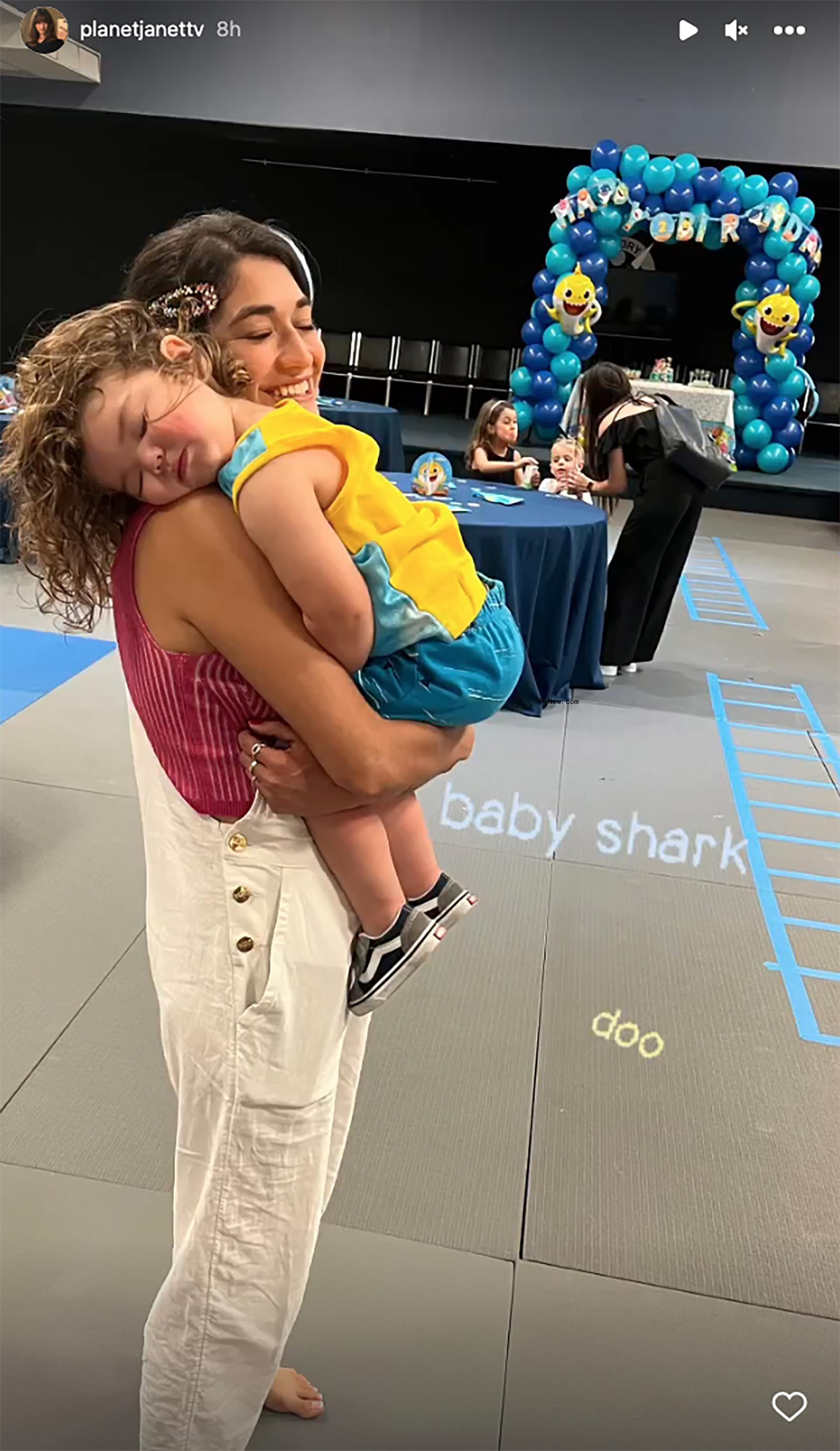 Janet Von Schmeling cuddles son at birthday party