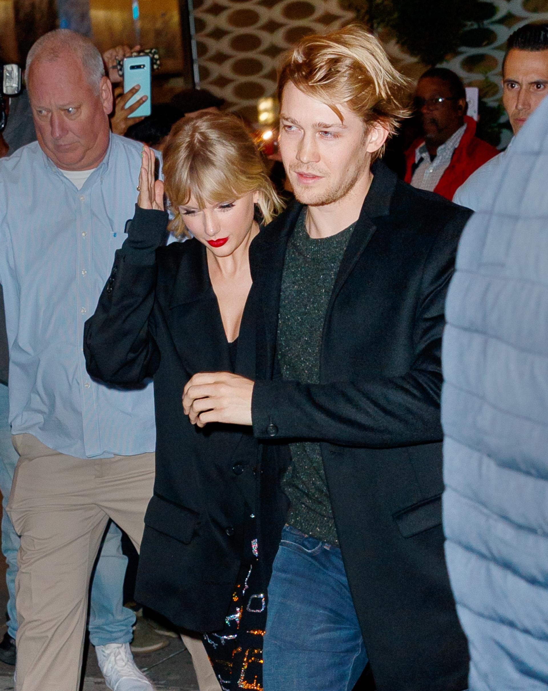 Taylor Swift and Joe Alwyn walking together