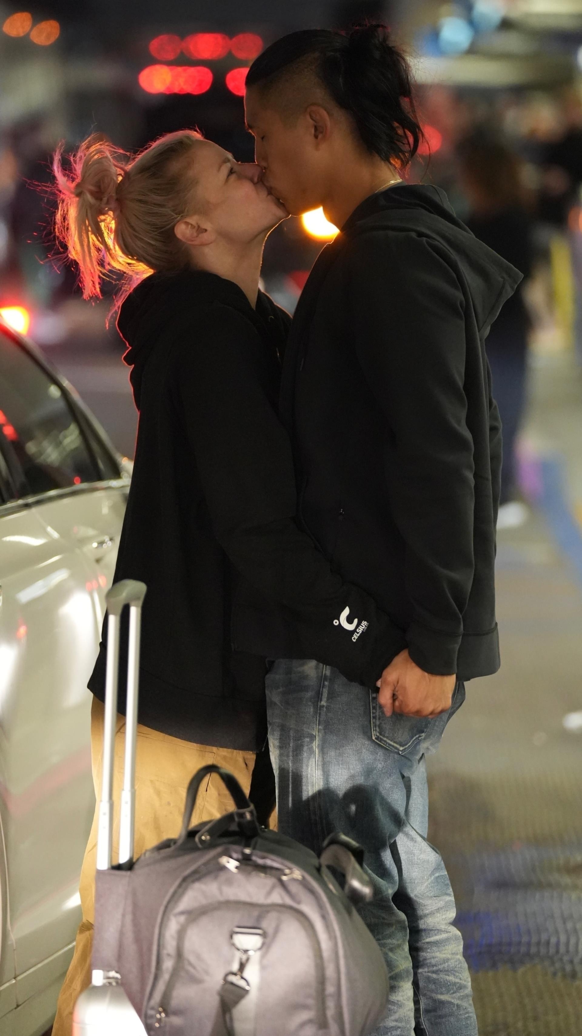 Ariana Madix kissing a man.