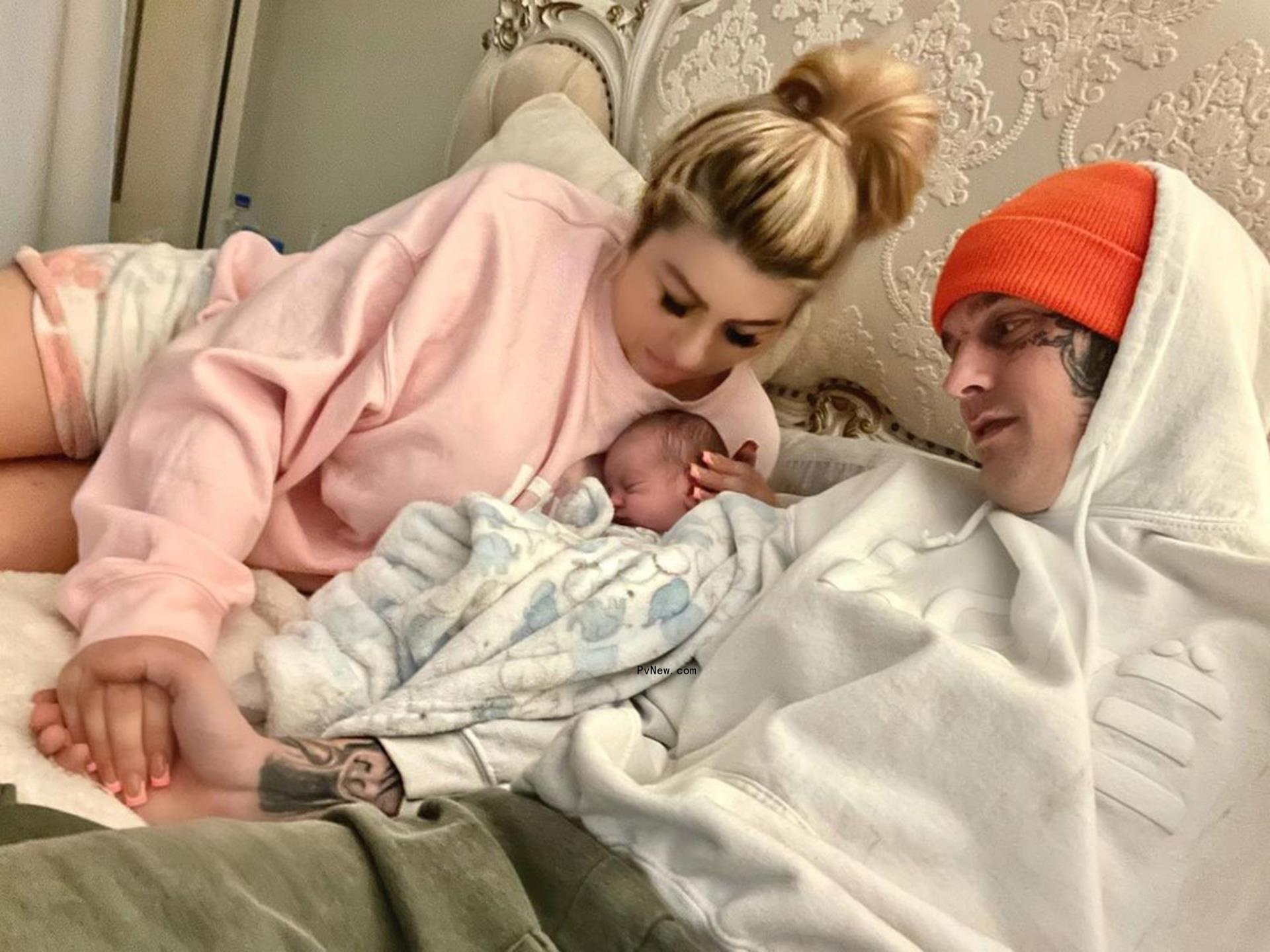 Aaron Carter and Melanie Martin in bed with their son Prince