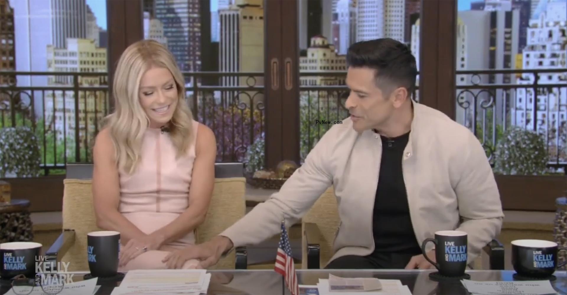Kelly Ripa and Mark Co<i></i>nsuelos sitting on 