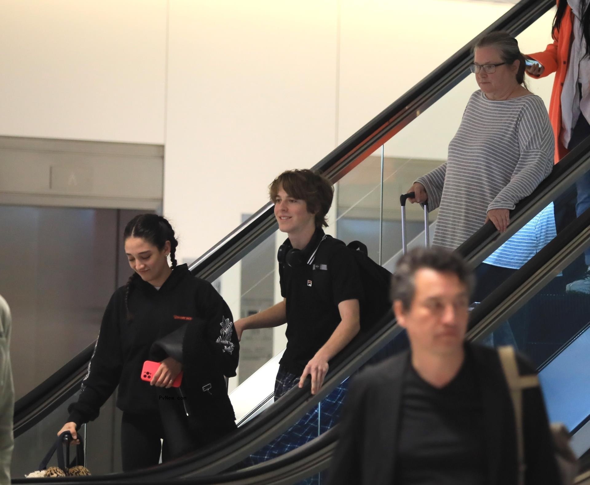 Bridget Fo<i></i>nda on escalator.