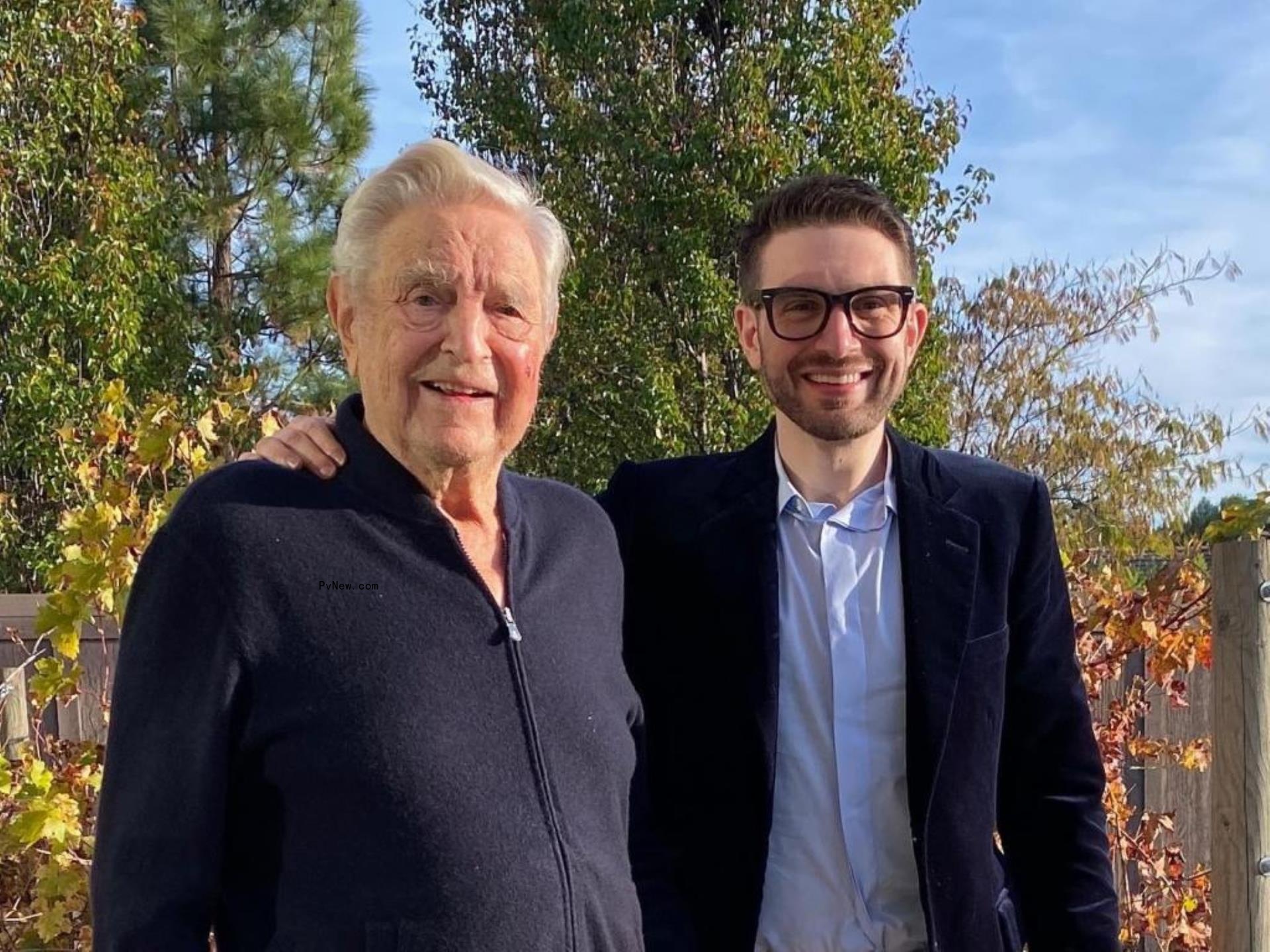 Alex Soros poses with his dad George Soros.