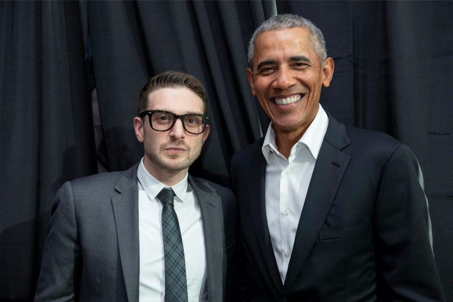 Alex Soros stands with Barack Obama.