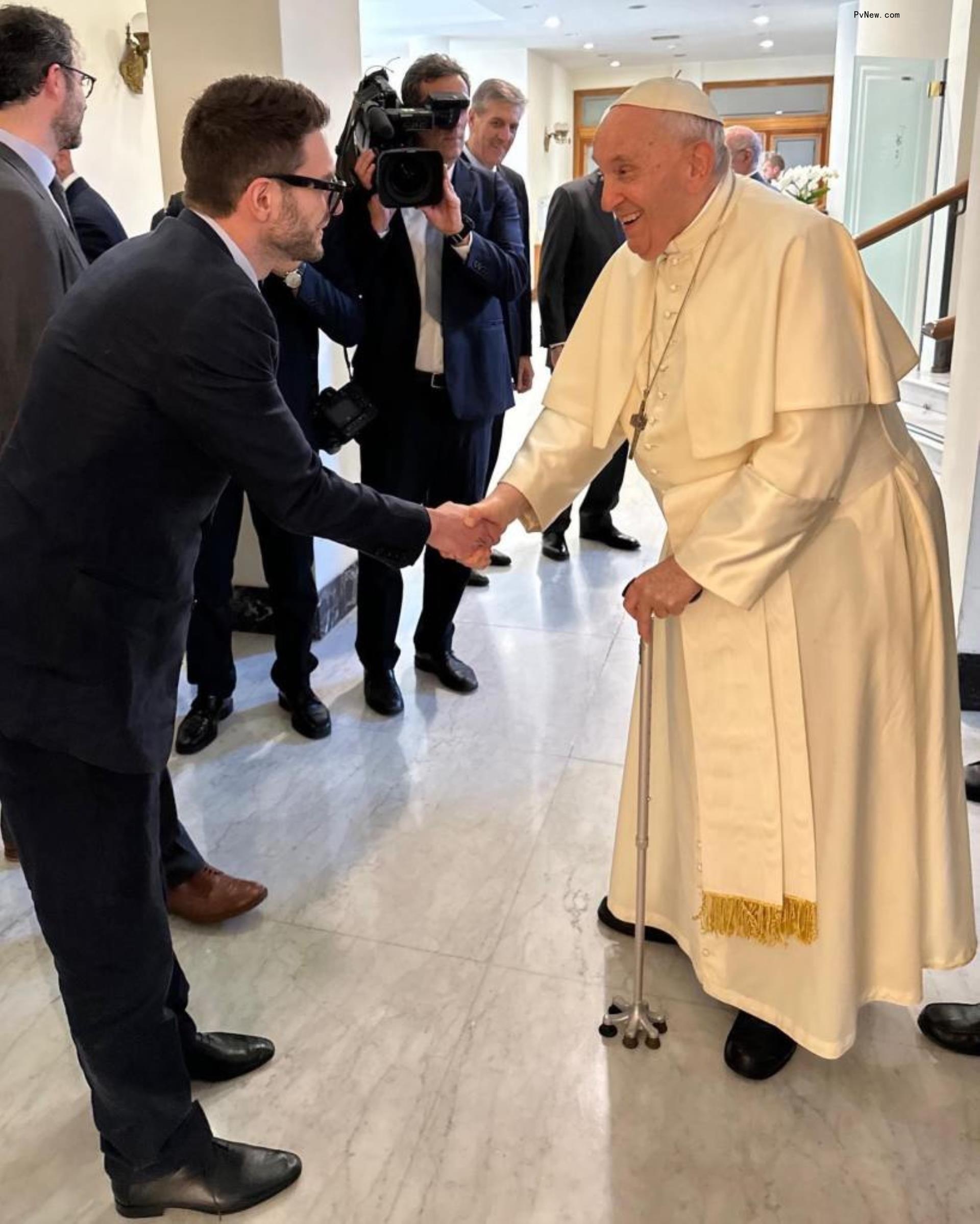 Alex Soros greets Pope Francis.