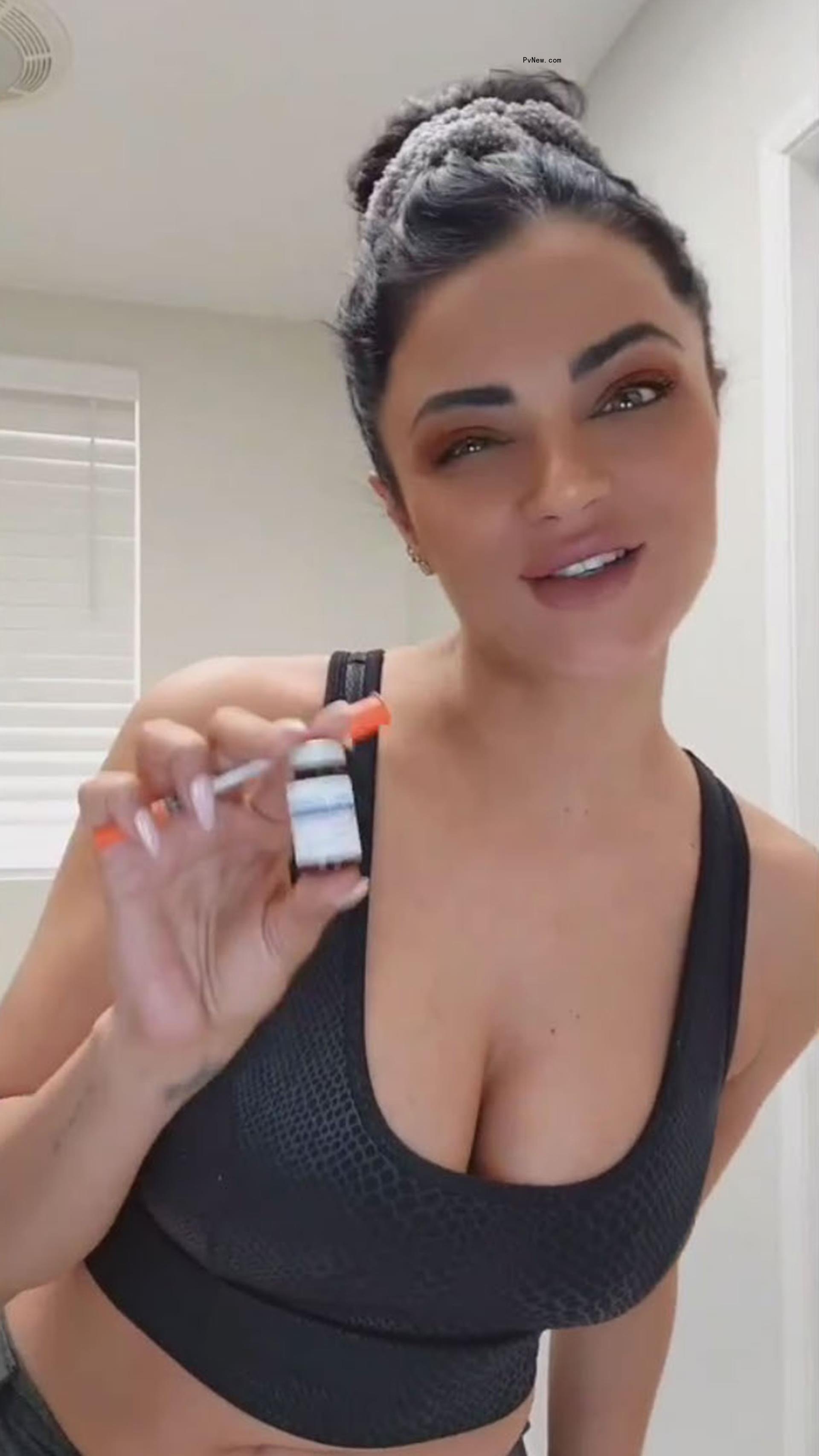 Golnesa 'GG' Gharachedaghi holding medication.