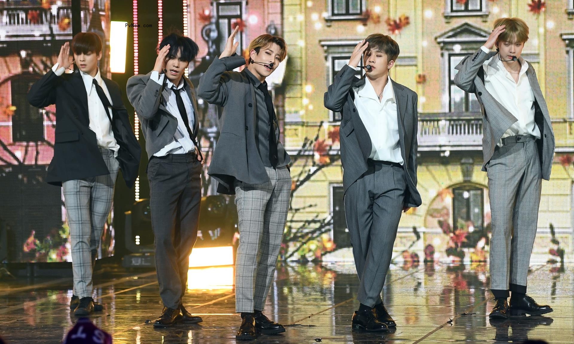 Astro performing onstage.