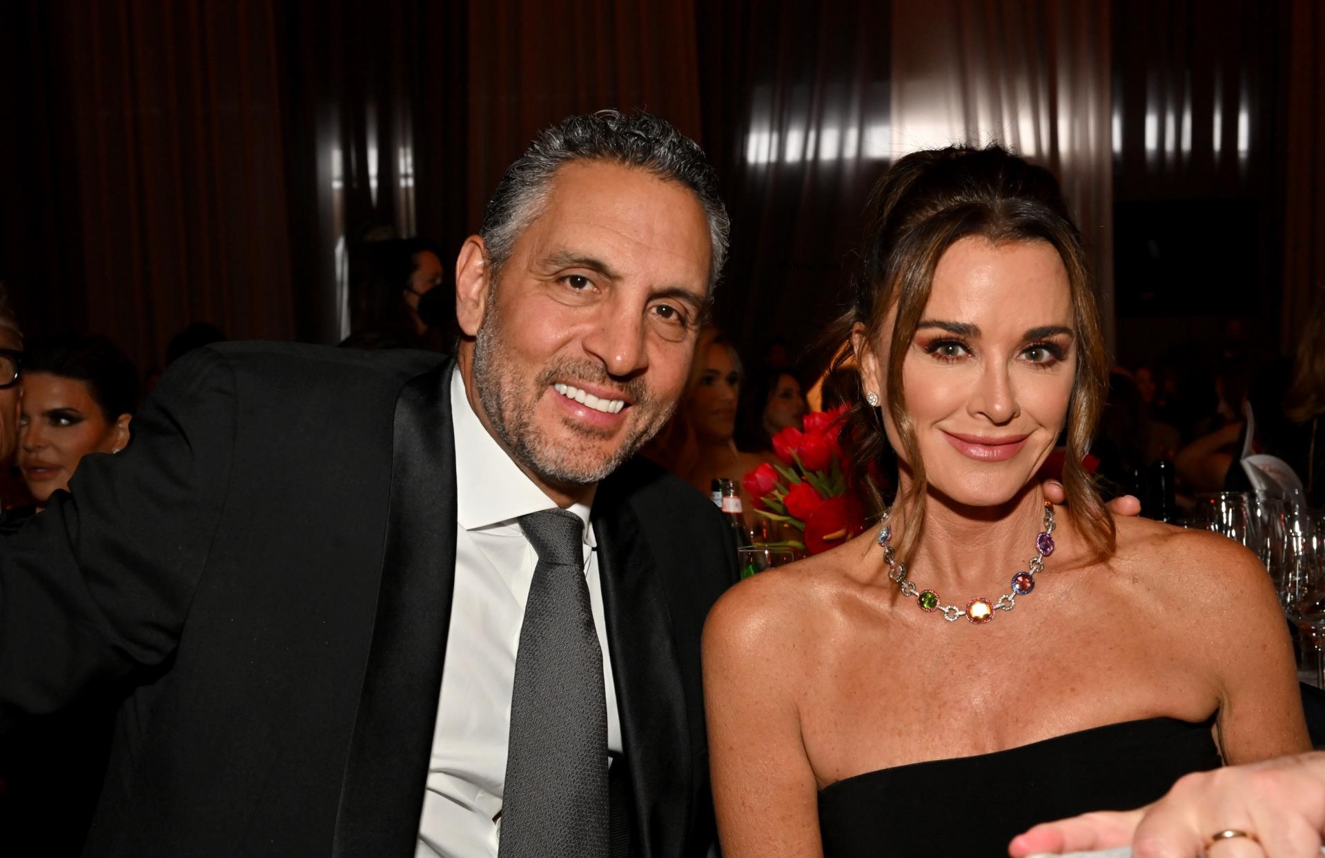 Mauricio Umansky and Kyle Richards smiling at an event